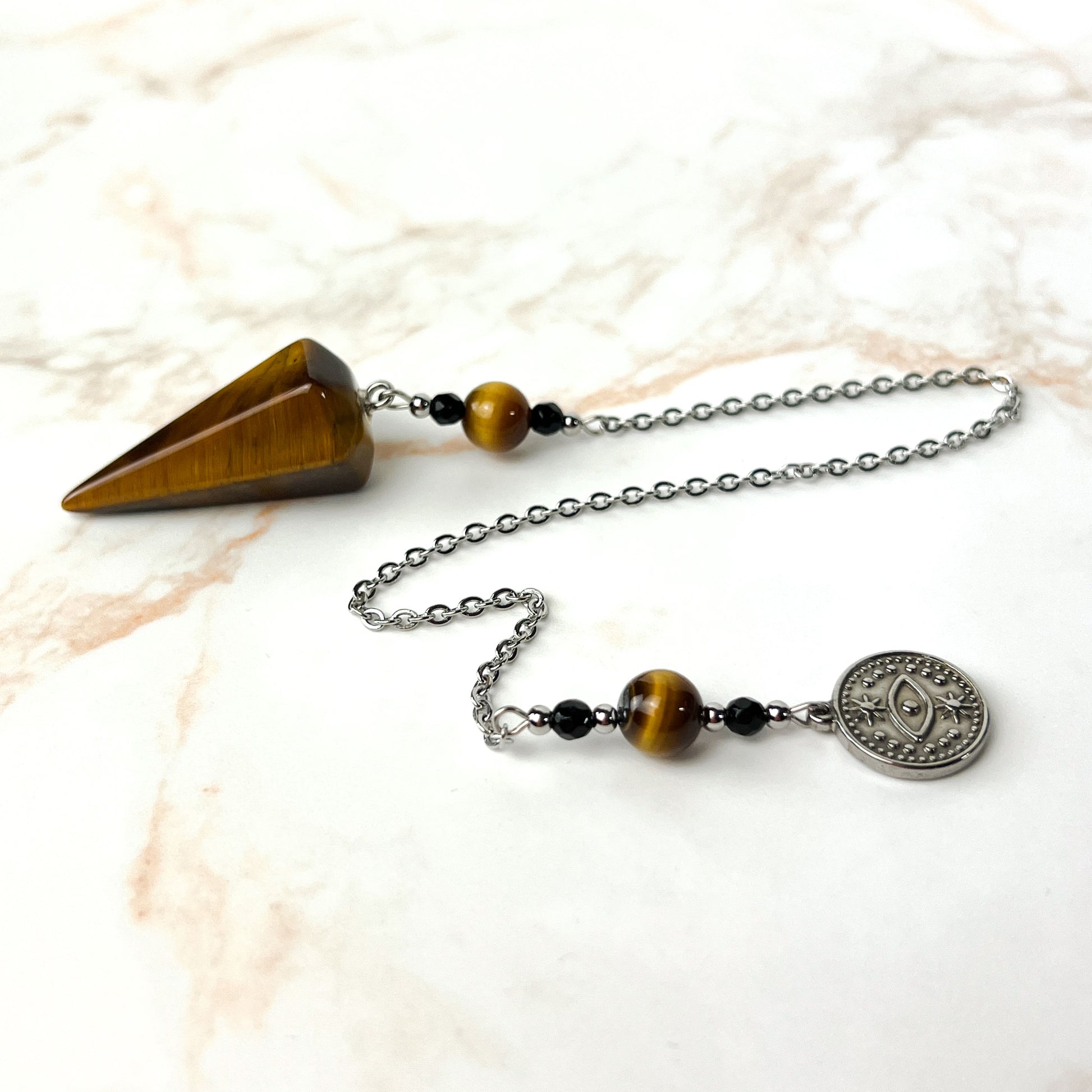 Tiger eye and onyx dowsing stainless steel pendulum with a third eye charm Baguette Magick