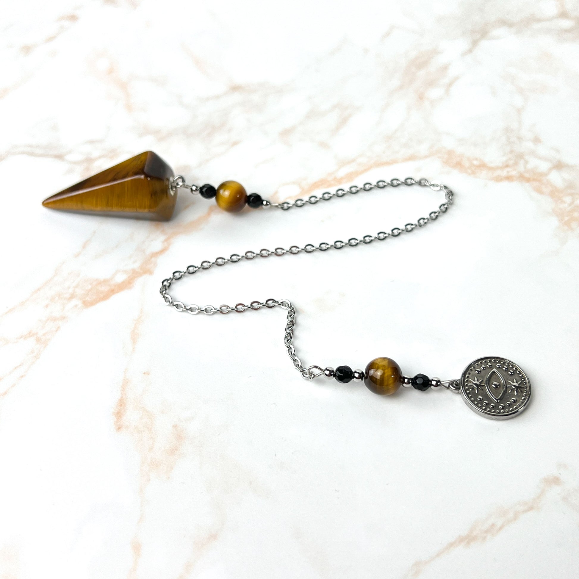 Tiger eye and onyx dowsing stainless steel pendulum with a third eye charm Baguette Magick