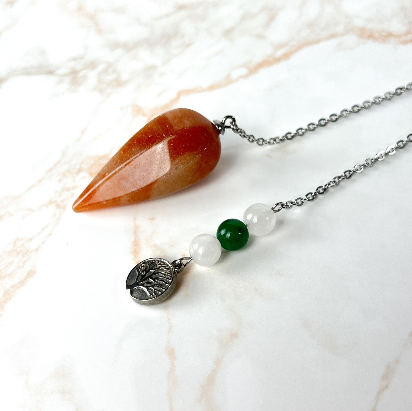 Orange and green aventurine, clear quartz, and tree of life stainless steel pendulum Baguette Magick