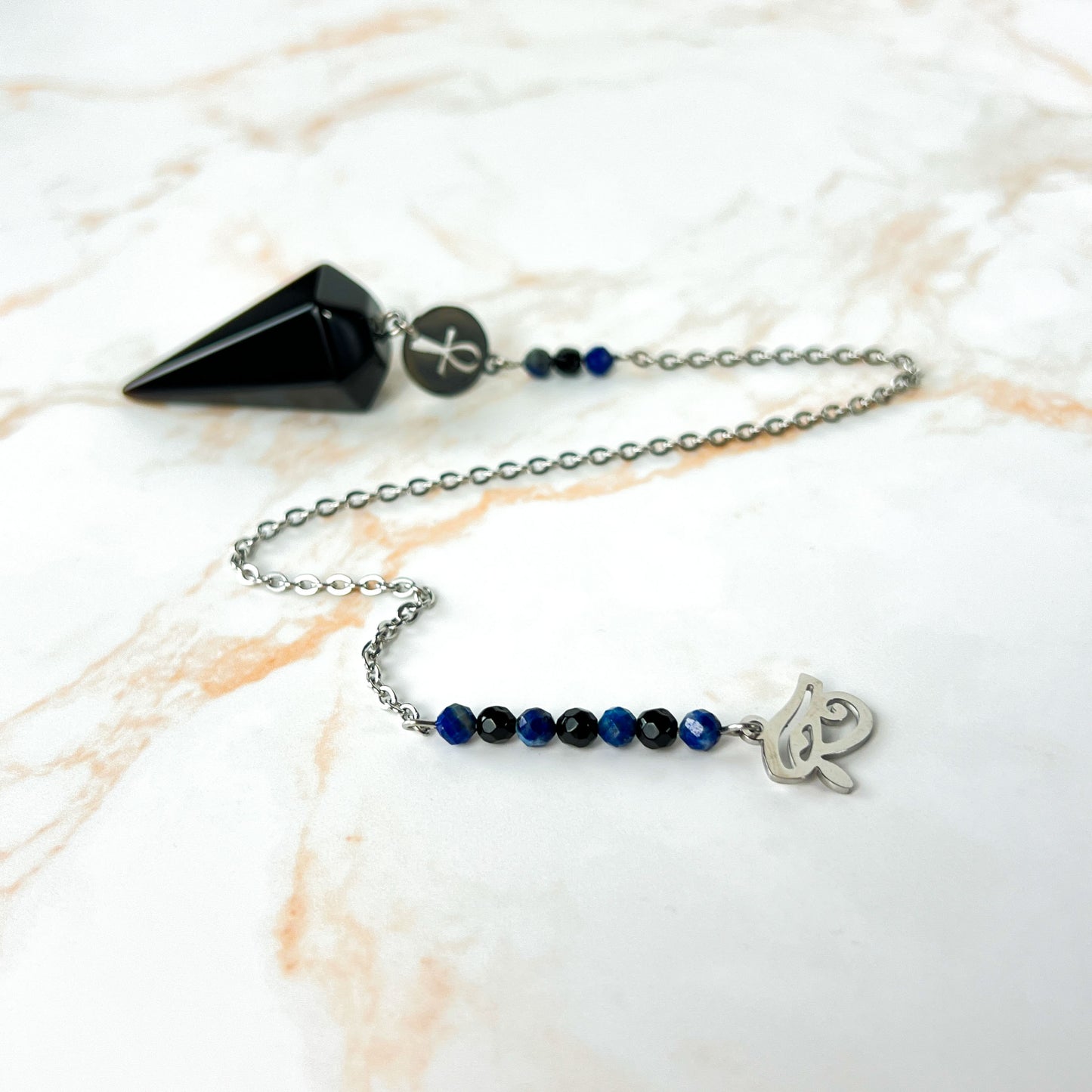 Stainless steel pendulum with obsidian, lapis lazuli, onyx, Eye of Horus and Ankh Baguette Magick