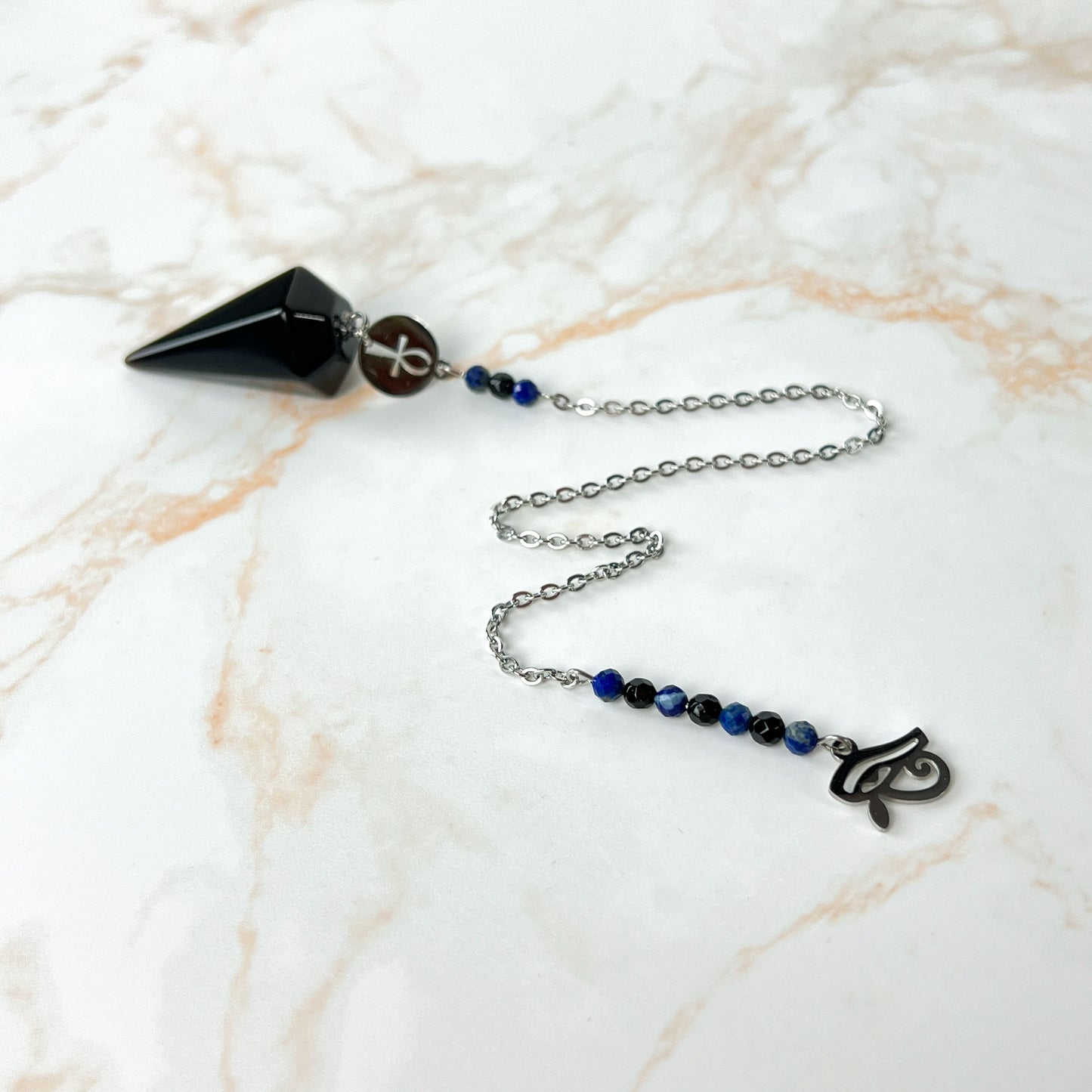 Stainless steel pendulum with obsidian, lapis lazuli, onyx, Eye of Horus and Ankh Baguette Magick