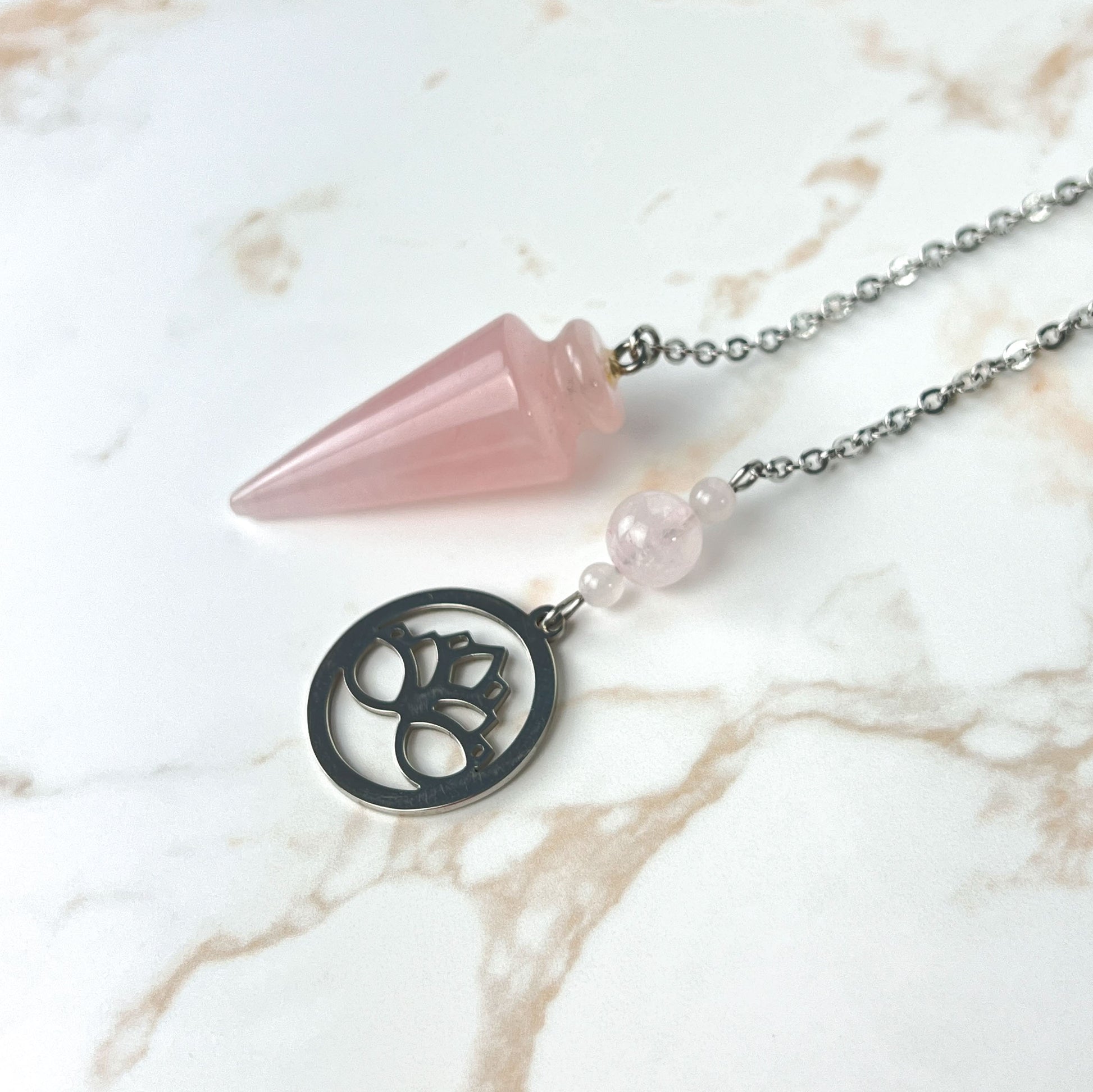 Rose quartz and stainless steel lotus flower pendulum Baguette Magick