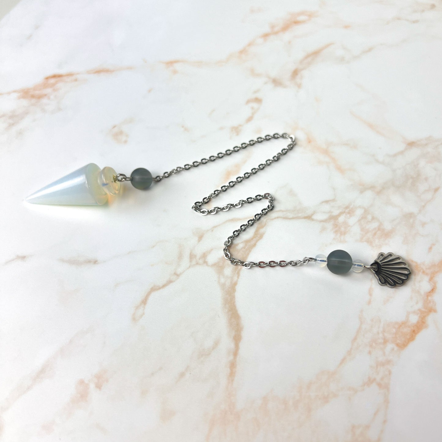 Sea witch pendulum made with opalite, stainless steel and mermaid glass Baguette Magick
