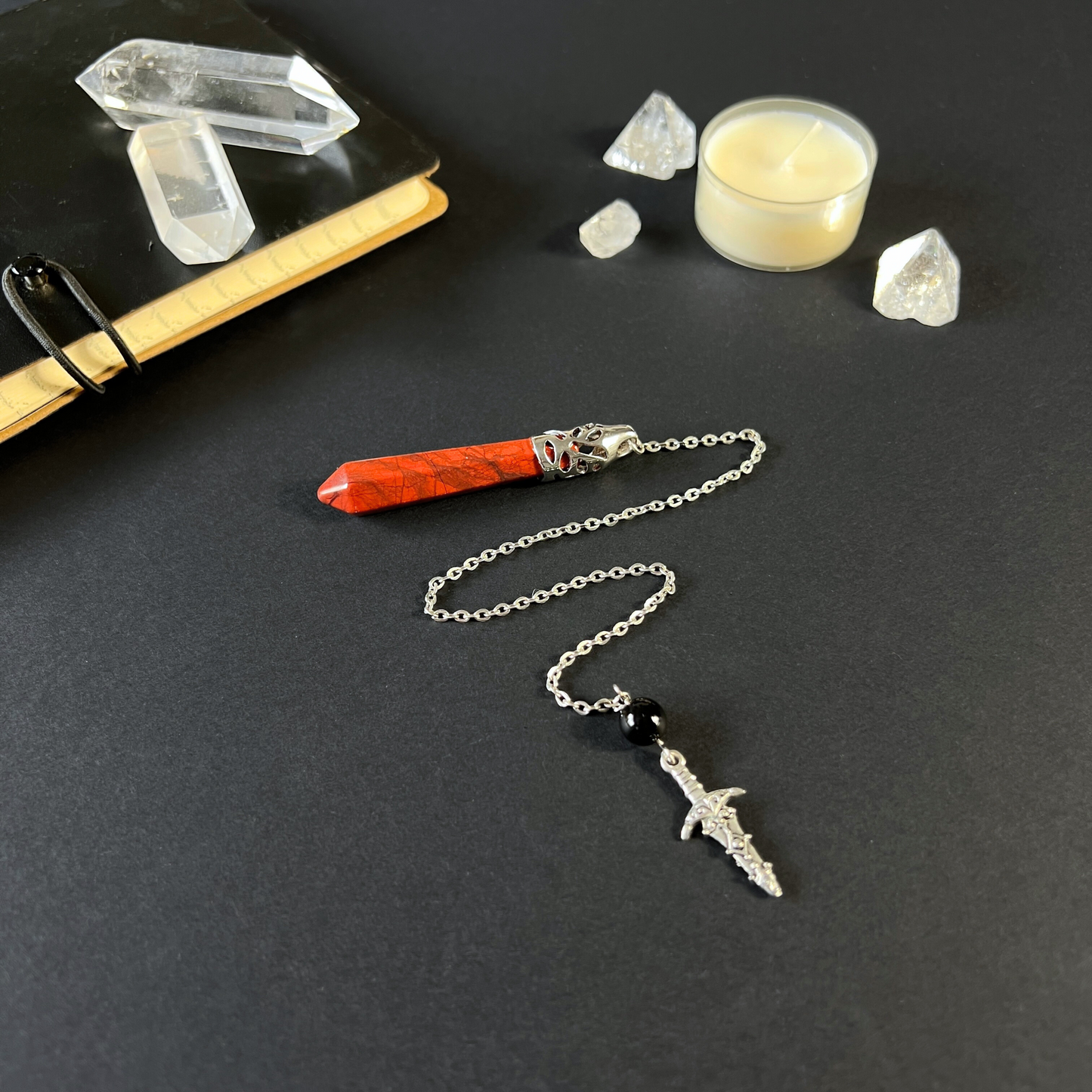 Red jasper and obsidian dagger pendulum