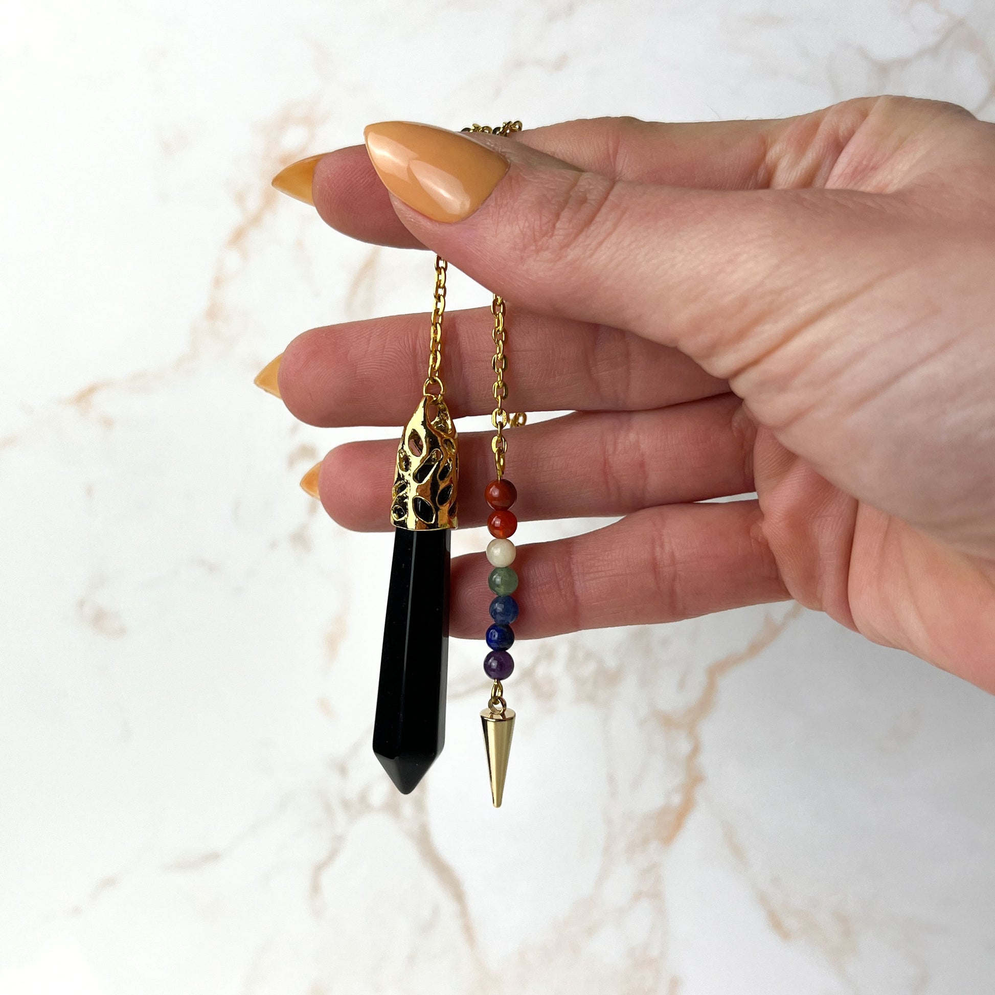 Golden onyx and seven chakras stones pendulum with a spike Baguette Magick