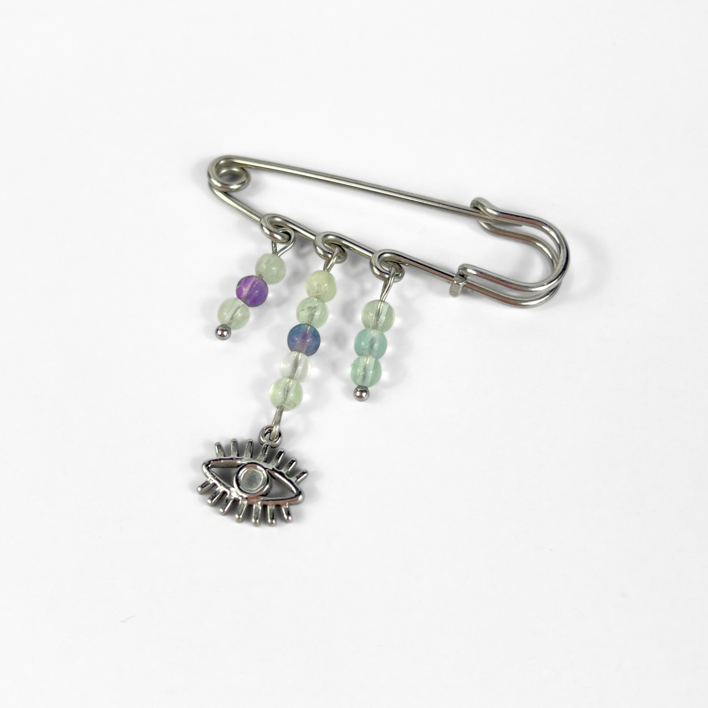 Kilt pin brooch adorned with gemstones, crystal, charms