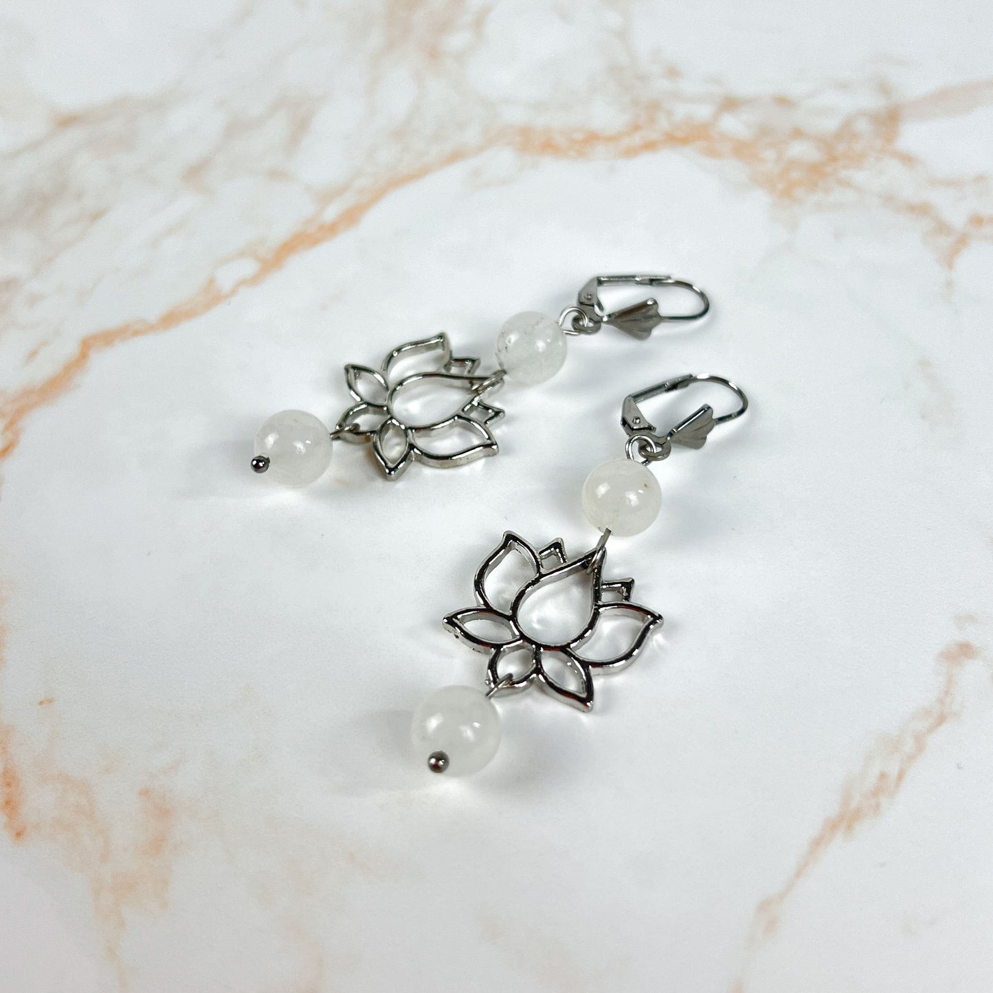 Clear quartz and lotus flower spiritual earrings Baguette Magick