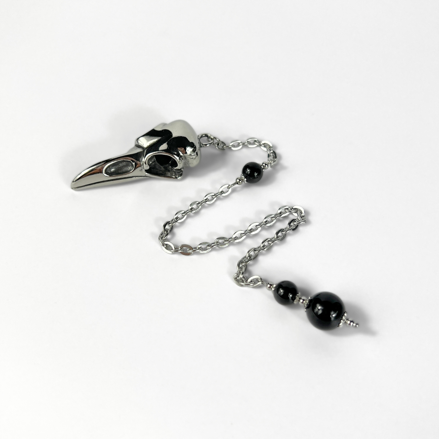 Raven skull and obsidian dowsing pendulum, stainless steel