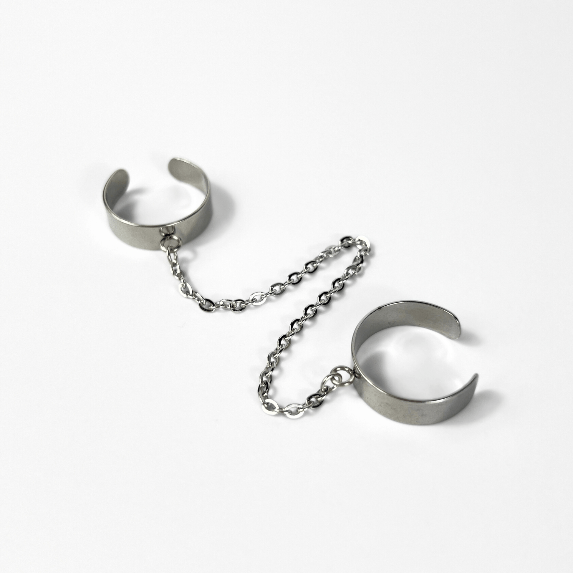 Sleek spikes or chain rings, polished stainless steel avant-garde jewelry Baguette Magick