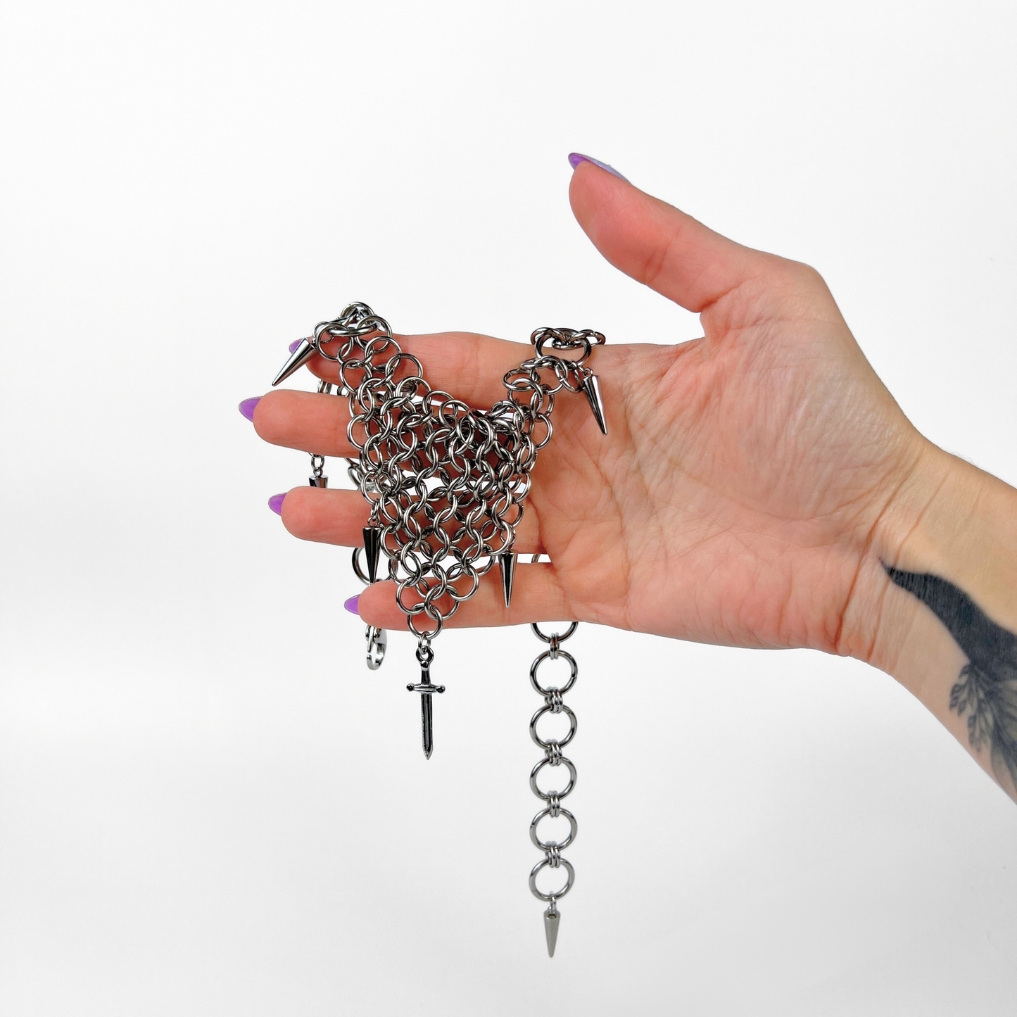 bold chainmail statement choker, with triangle parts, spikes, and dagger, silver tone stainless steel, corporate goth alt medieval fantasy style, necklace for women