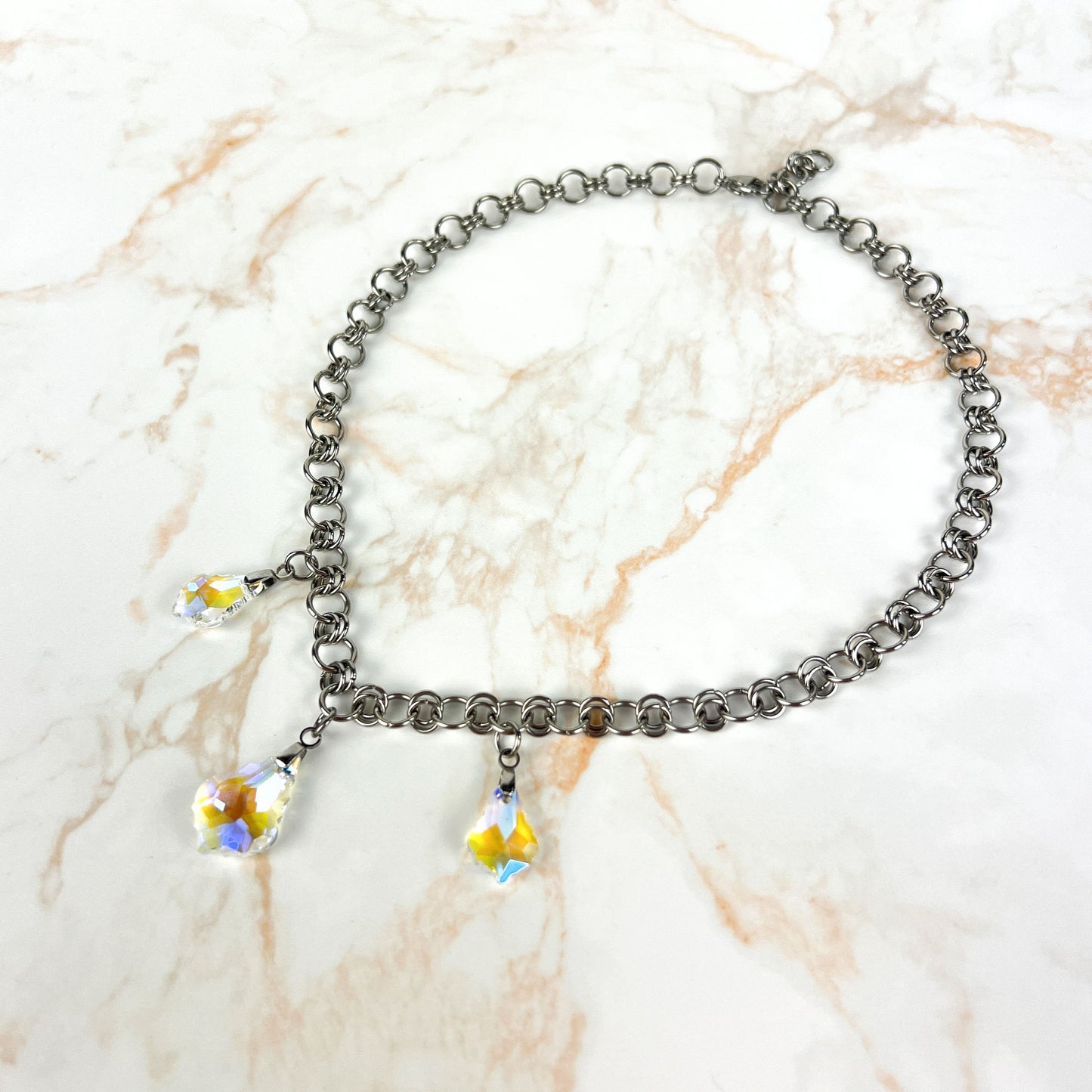 Sparkling crystal necklace, yellow and blue irridescence, chainmail chain, stainless steel