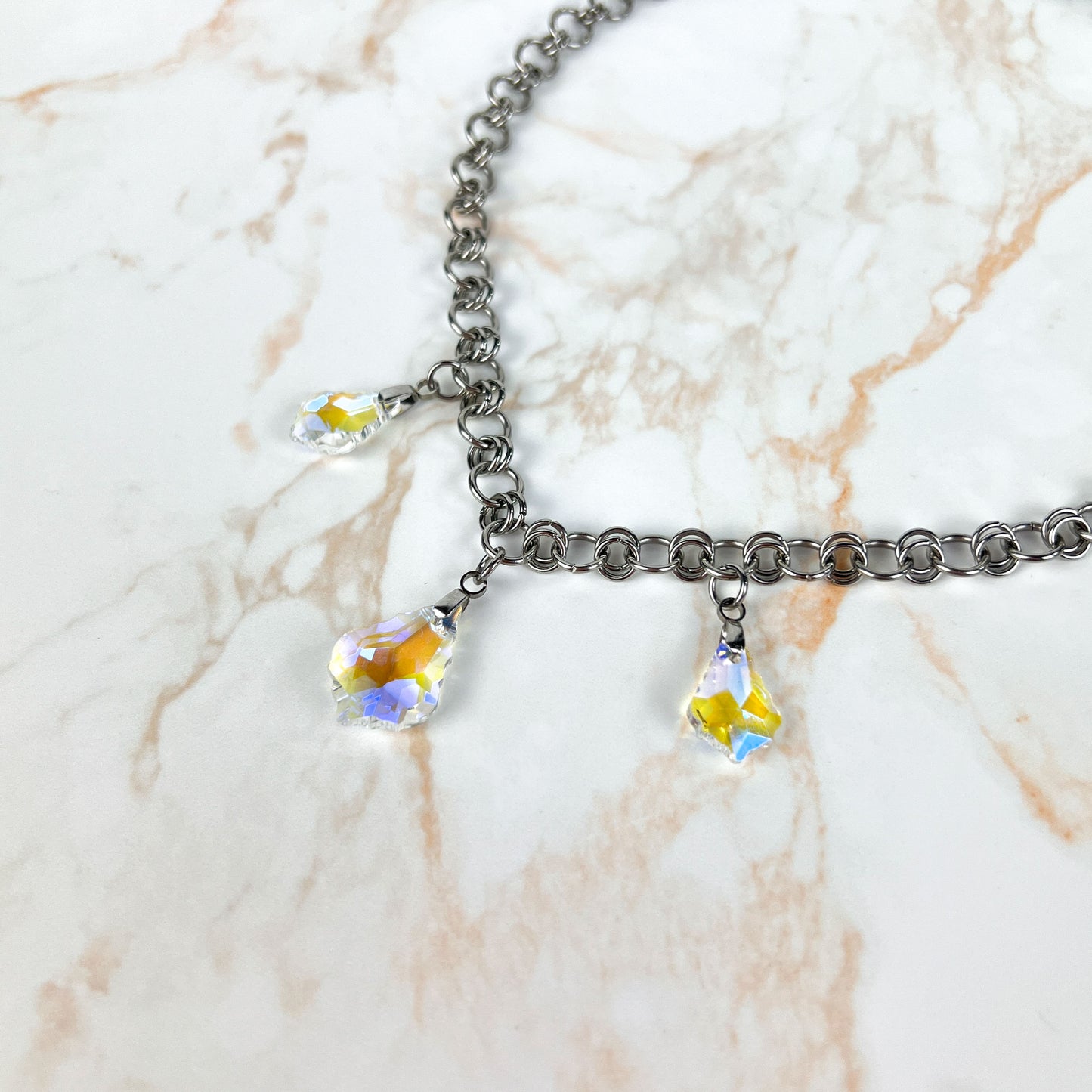 Sparkling crystal necklace, yellow and blue irridescence, chainmail chain, stainless steel