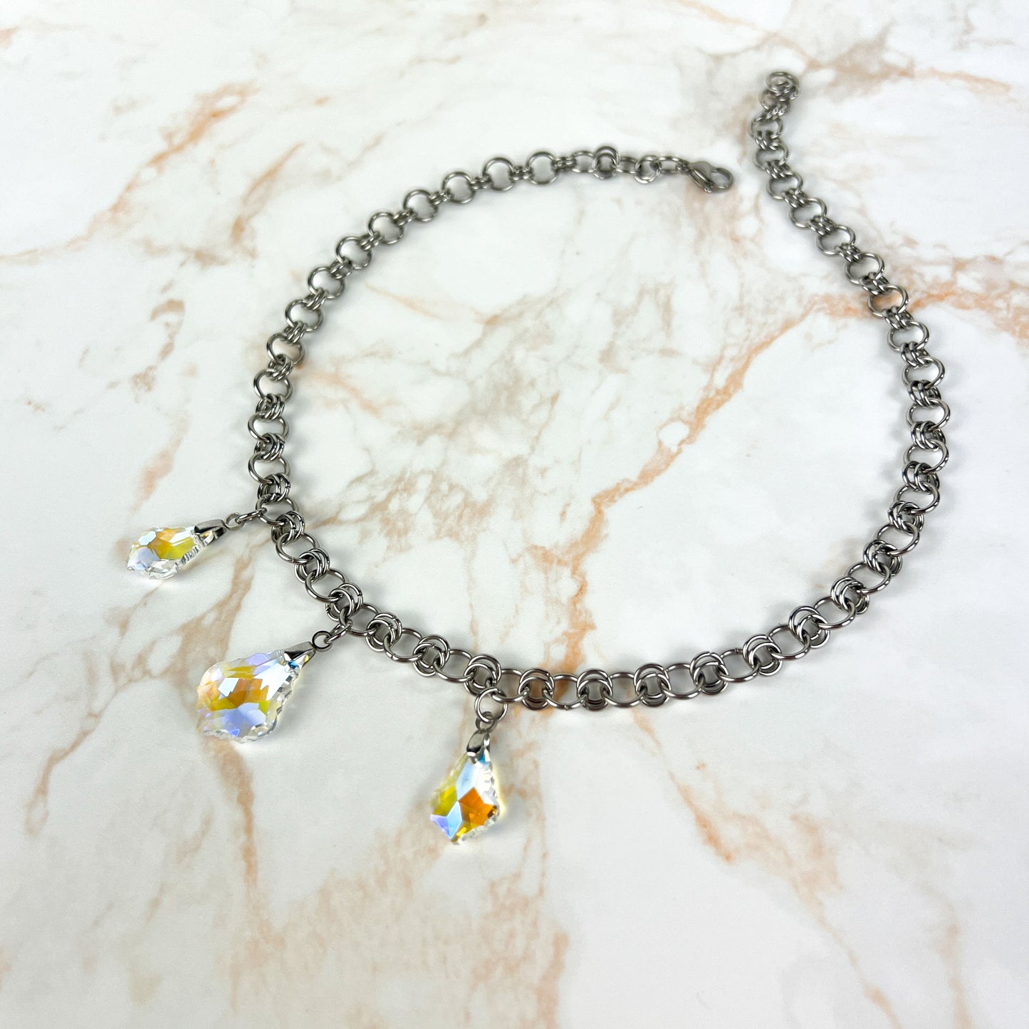 Sparkling crystal necklace, yellow and blue irridescence, chainmail chain, stainless steel