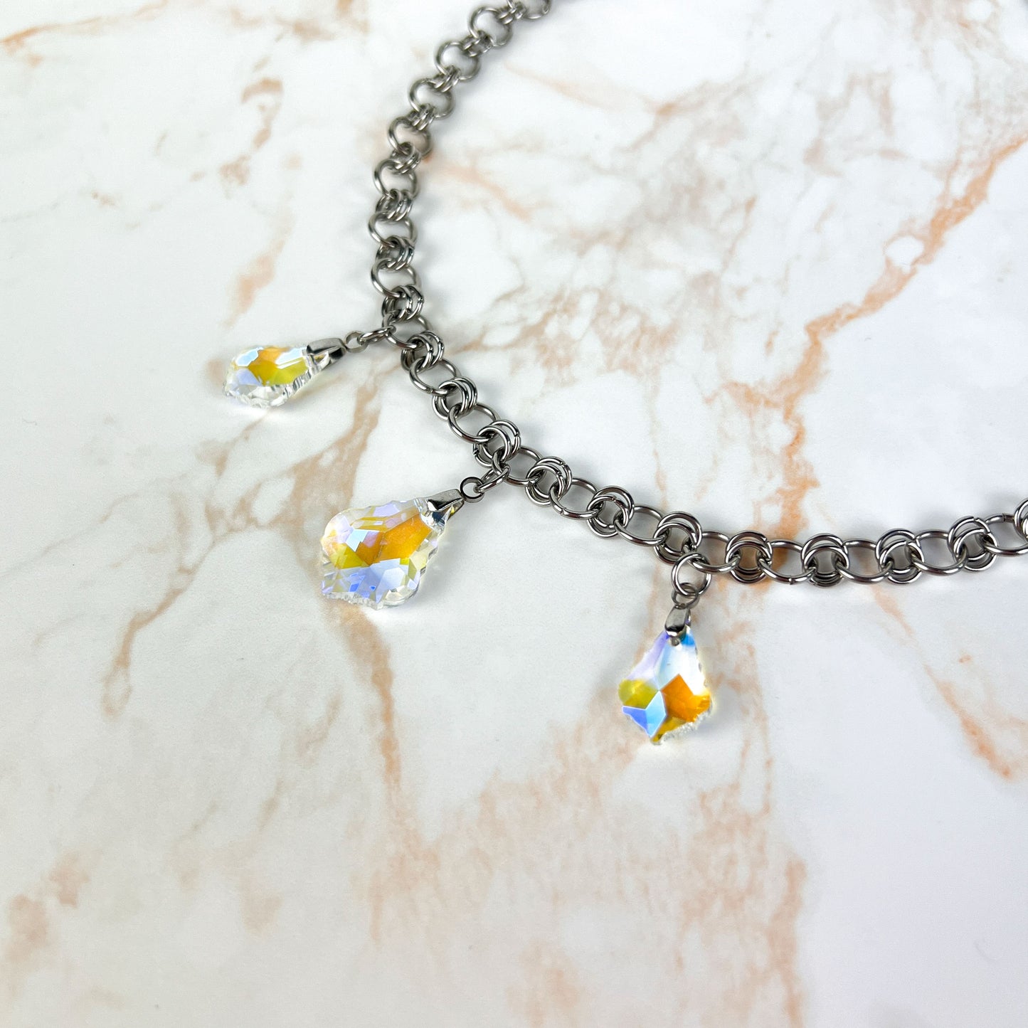 Sparkling crystal necklace, yellow and blue irridescence, chainmail chain, stainless steel