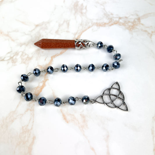 Goldstone pendulum, rosary chain and triquetra charm