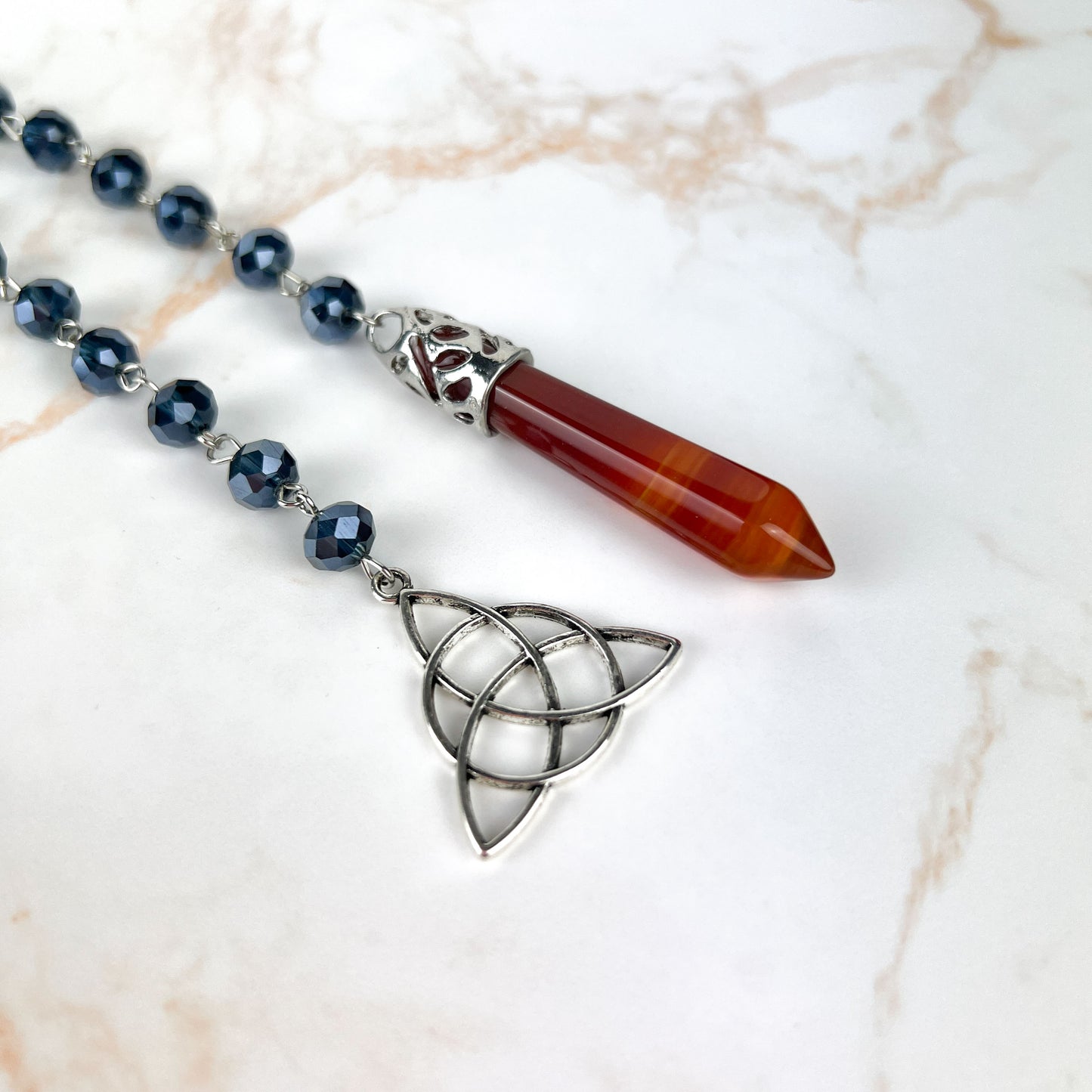 Carnelian gemstone pendulum, rosary chain and triquetra charm