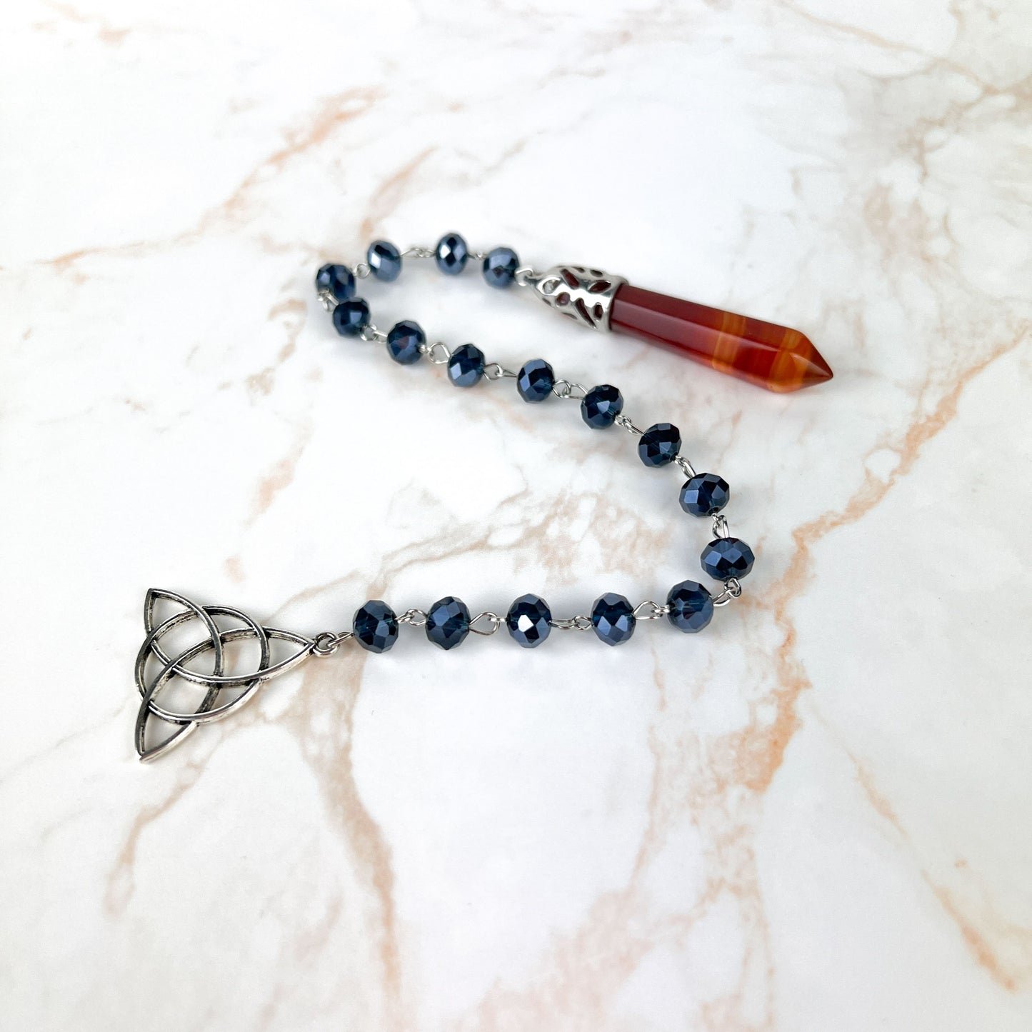 Carnelian gemstone pendulum, rosary chain and triquetra charm