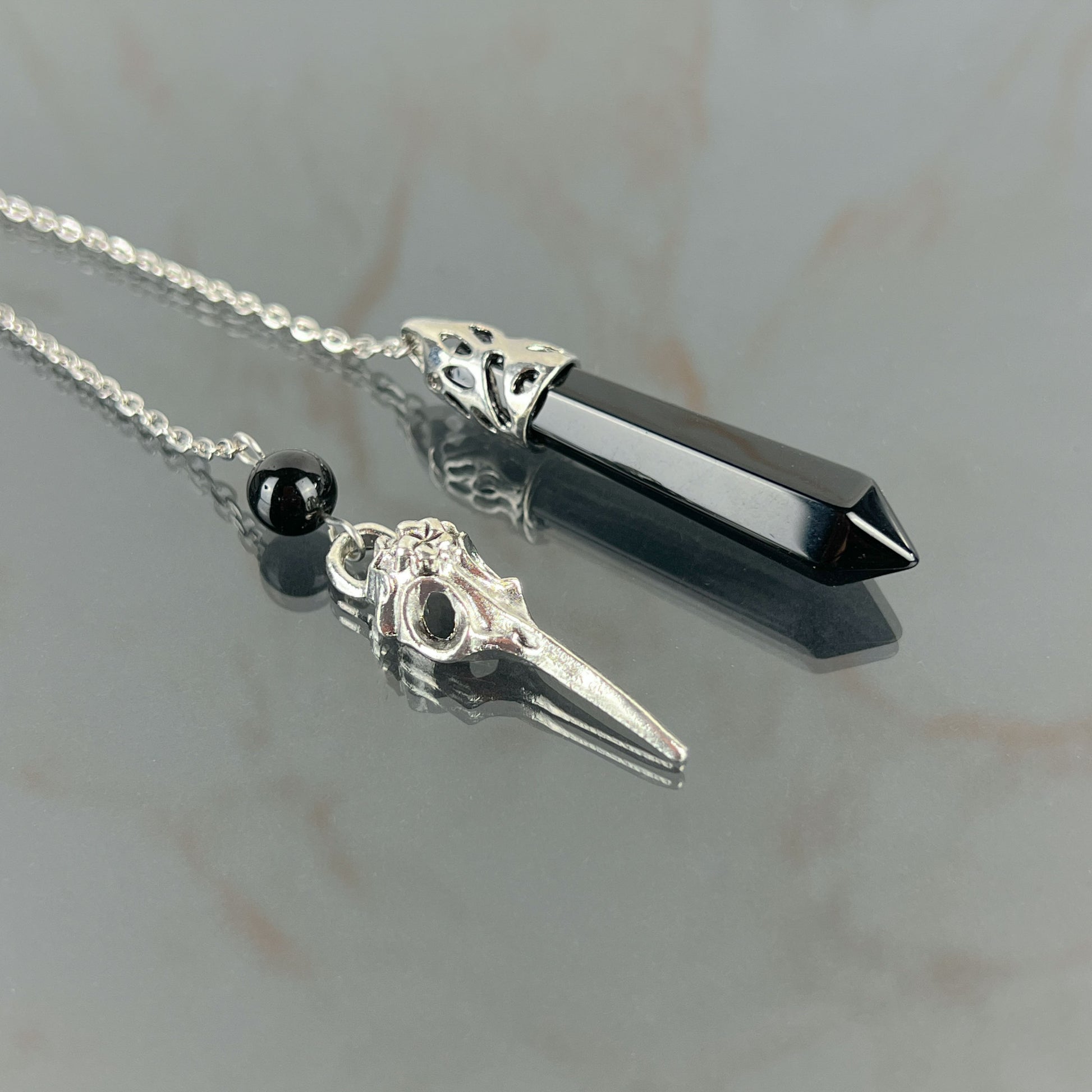 Onyx and bird skull dowsing pendulum Baguette Magick