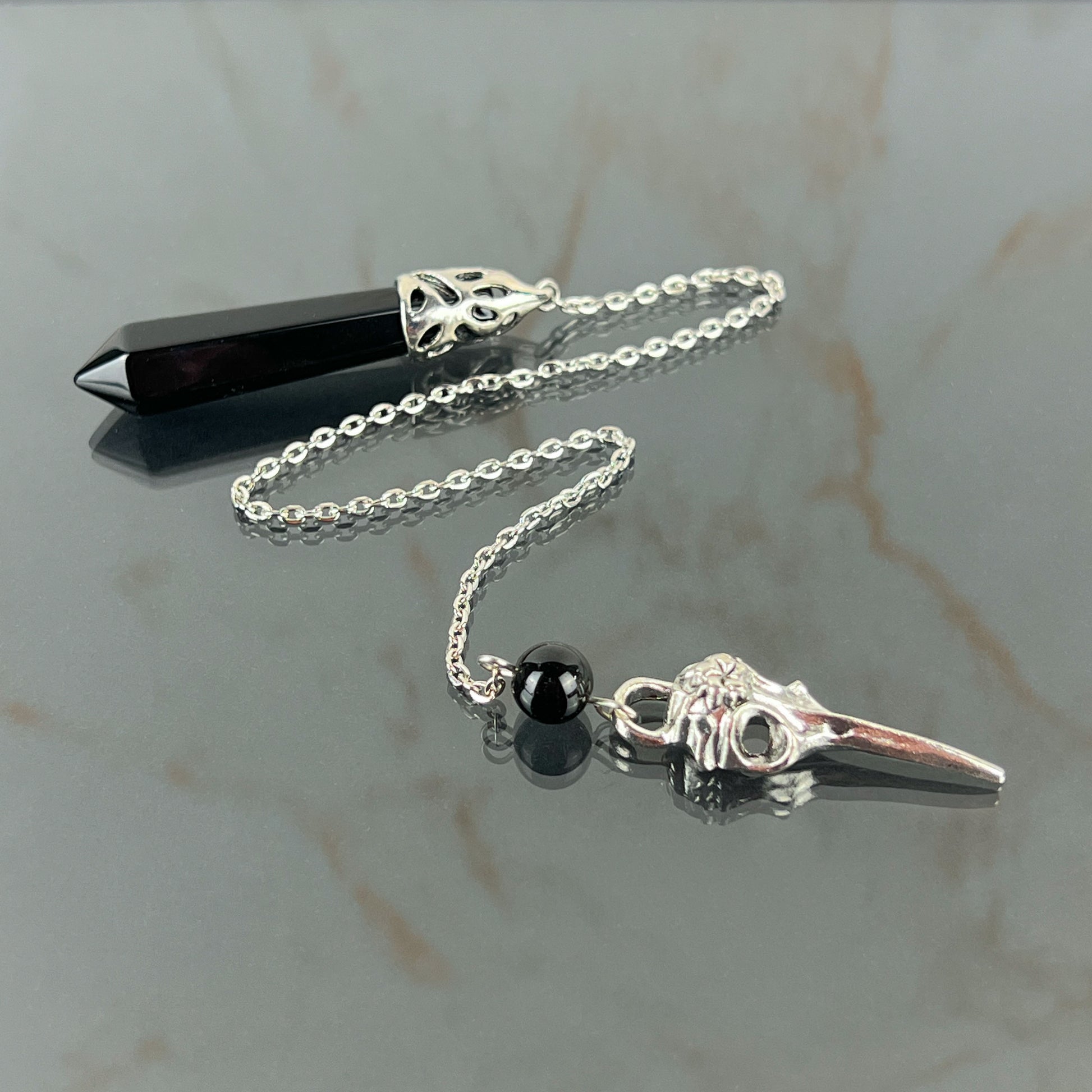 Onyx and bird skull dowsing pendulum Baguette Magick