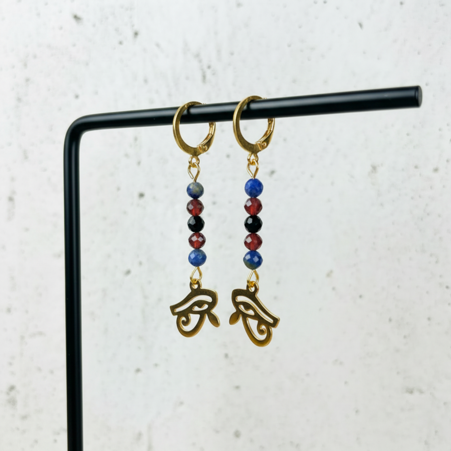 Golden Eye of Horus earrings, lapis lazuli, garnet and onyx Baguette Magick