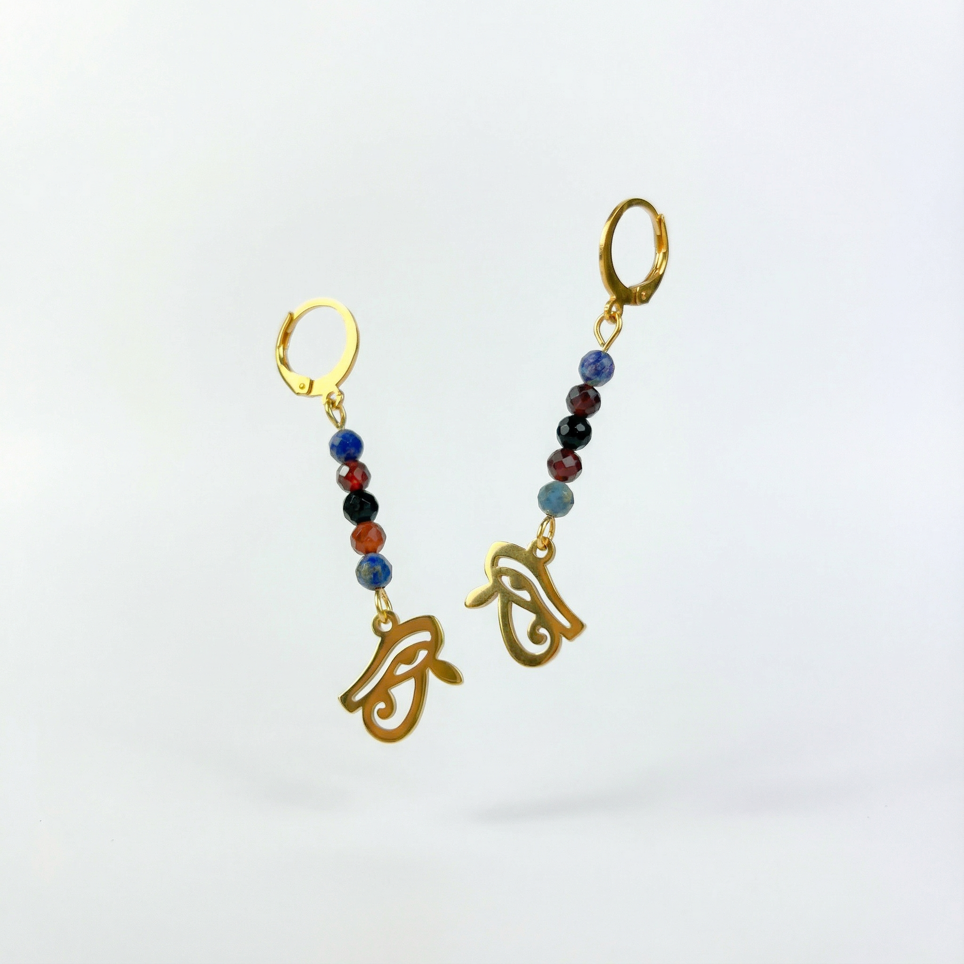 Golden Eye of Horus earrings, lapis lazuli, garnet and onyx Baguette Magick