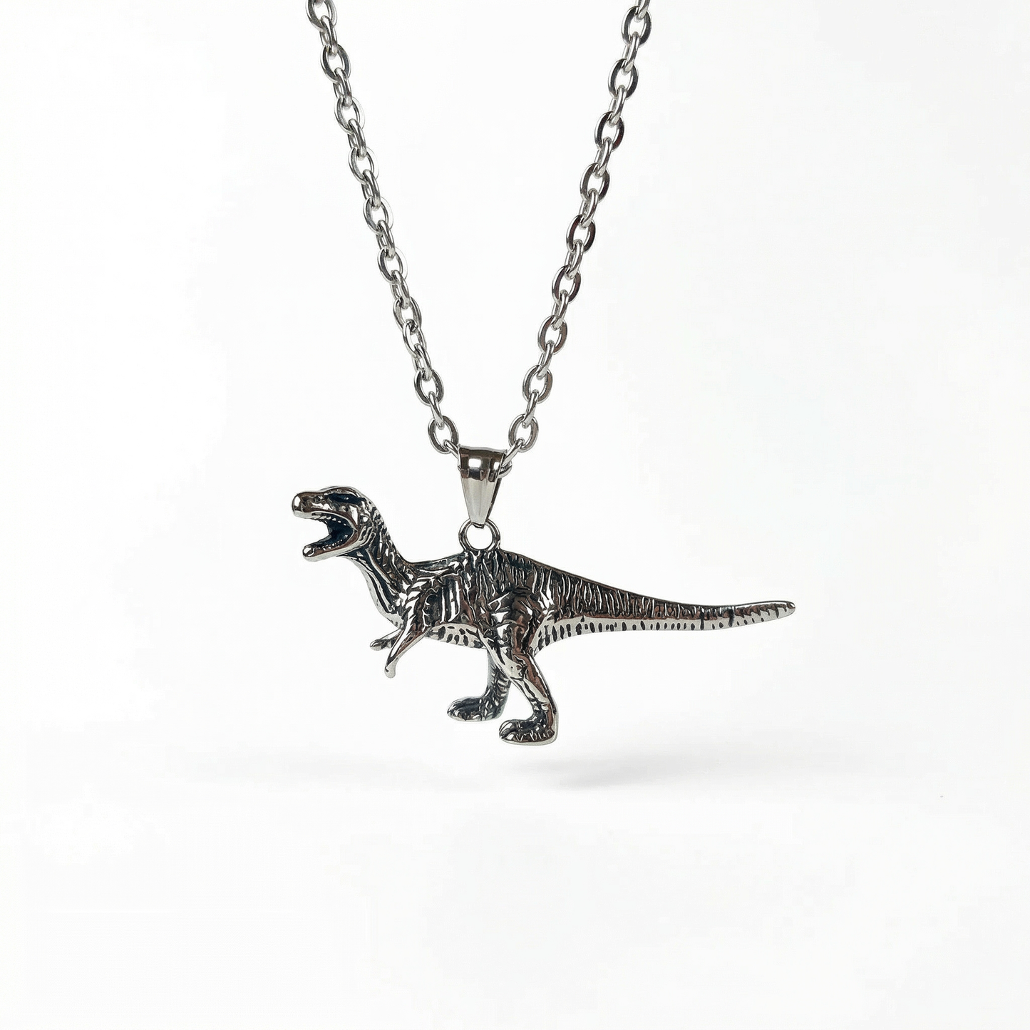 Raptor dinosaur necklace