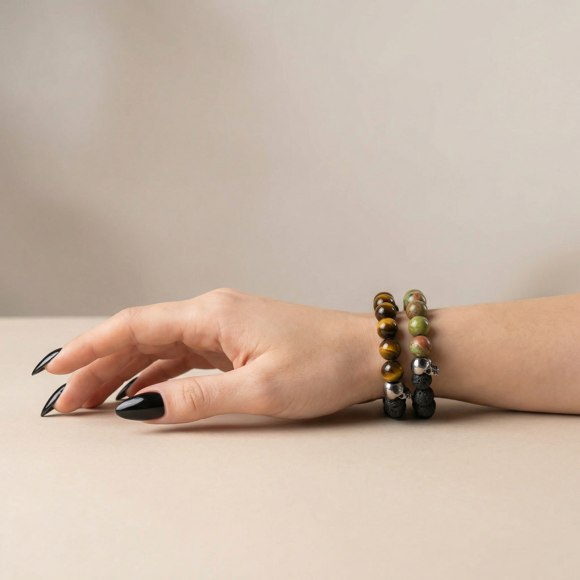 Lava rock and unakite or tiger's eye mala bracelet, with skulls Baguette Magick