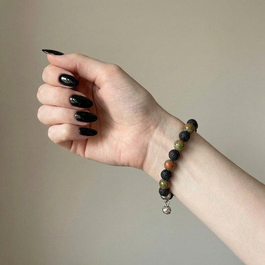 Unakite and lava mala beaded bracelet with a lotus seed charm