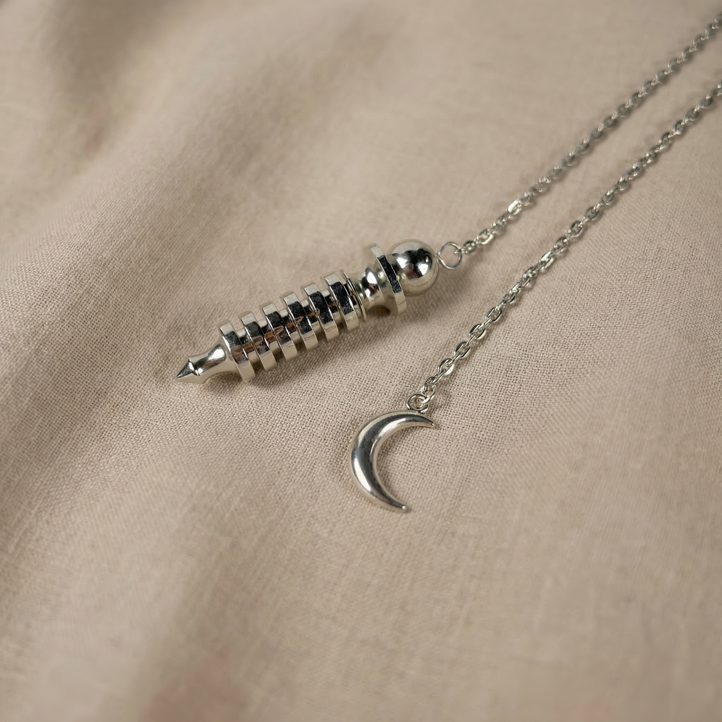 Egyptian Isis metal dowsing pendulum with a chamber and a Moon crescent