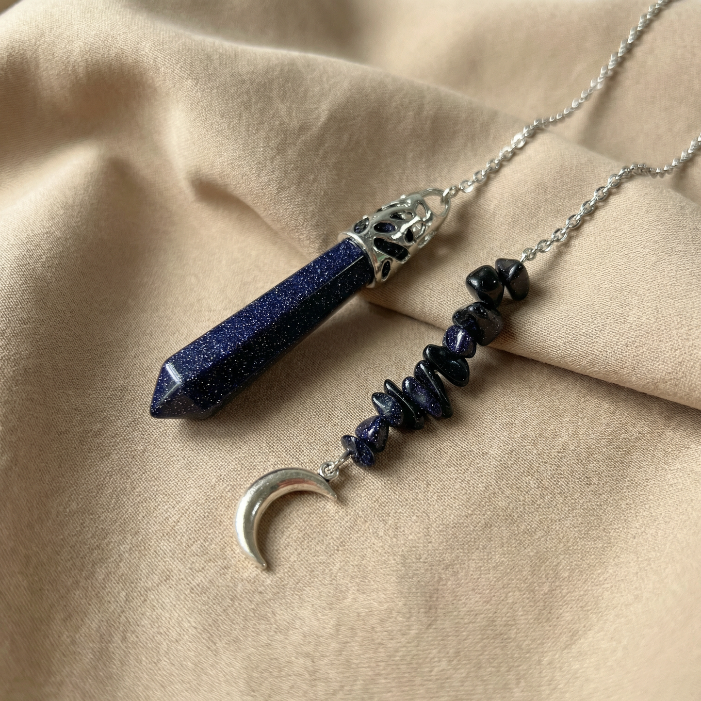 Blue sandstone pendulum with a Moon charm