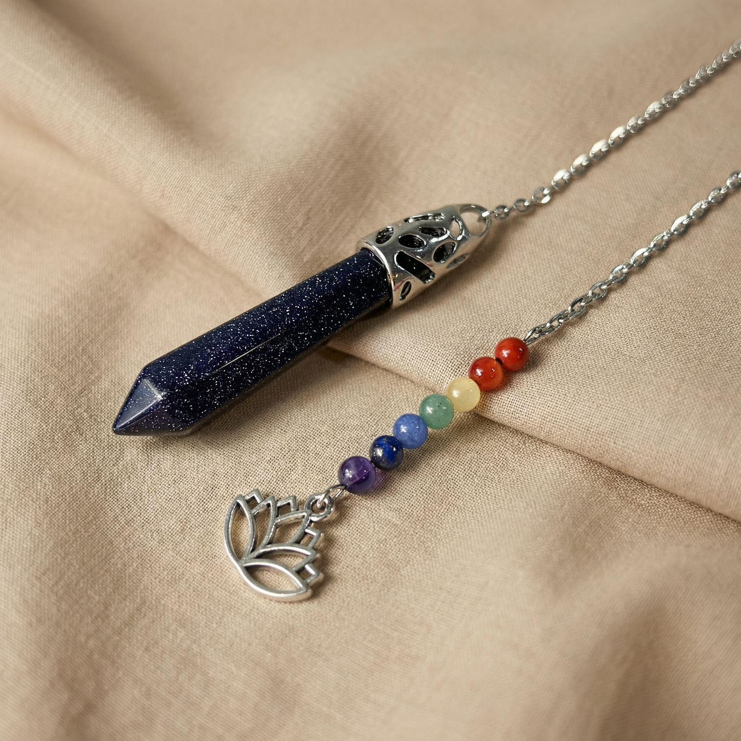 7 chakras blue sandstone pendulum with a lotus charm Baguette Magick