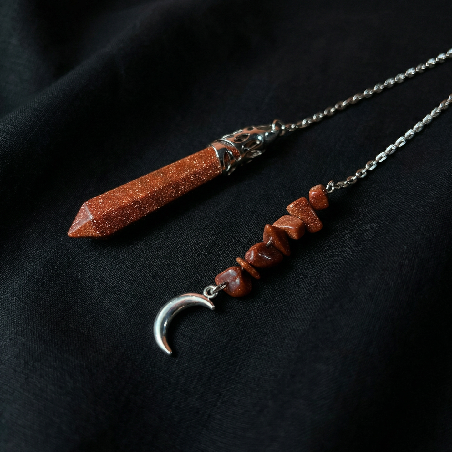 Goldstone pendulum with a crescent moon