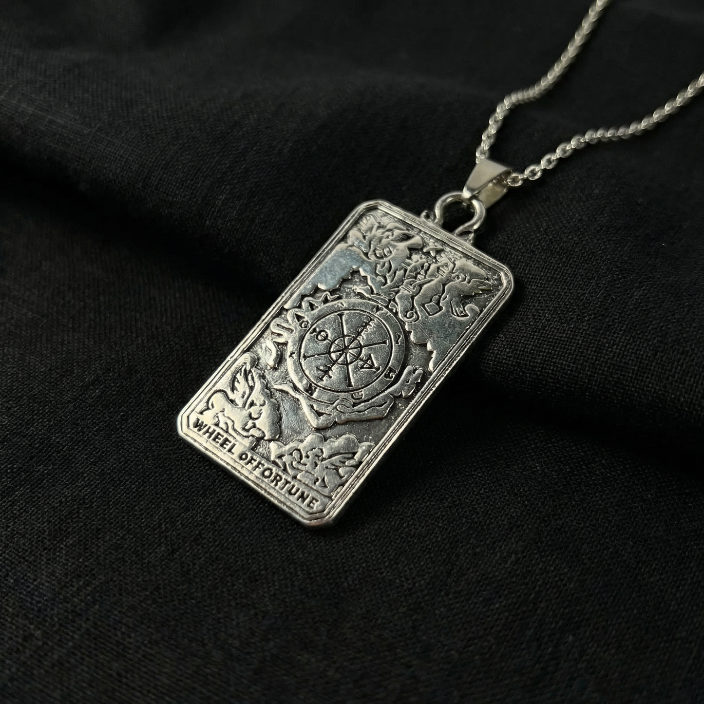 Wheel of fortune tarot arcana necklace with a reversible pendant