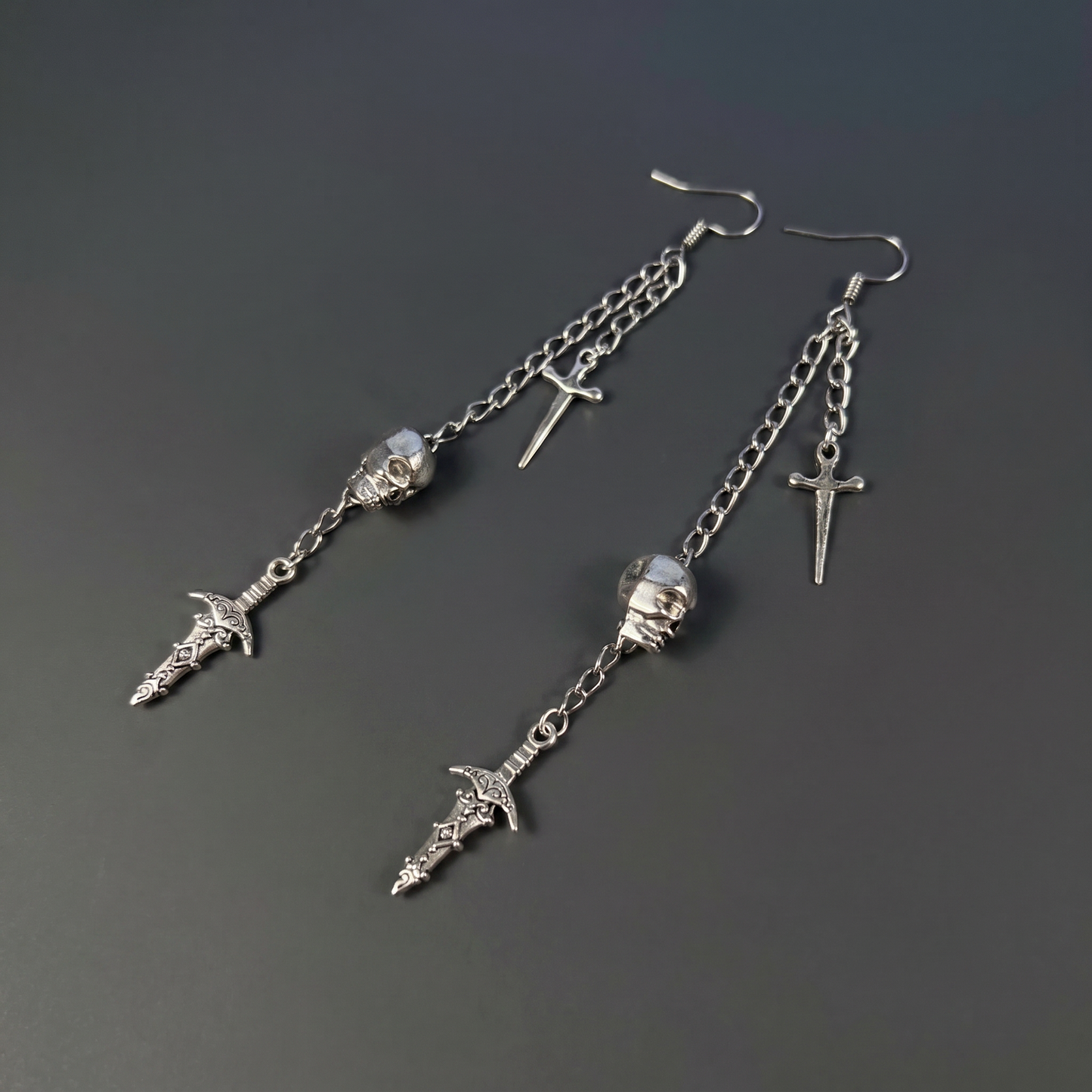 Skull and daggers dangle & drop earrings Baguette Magick