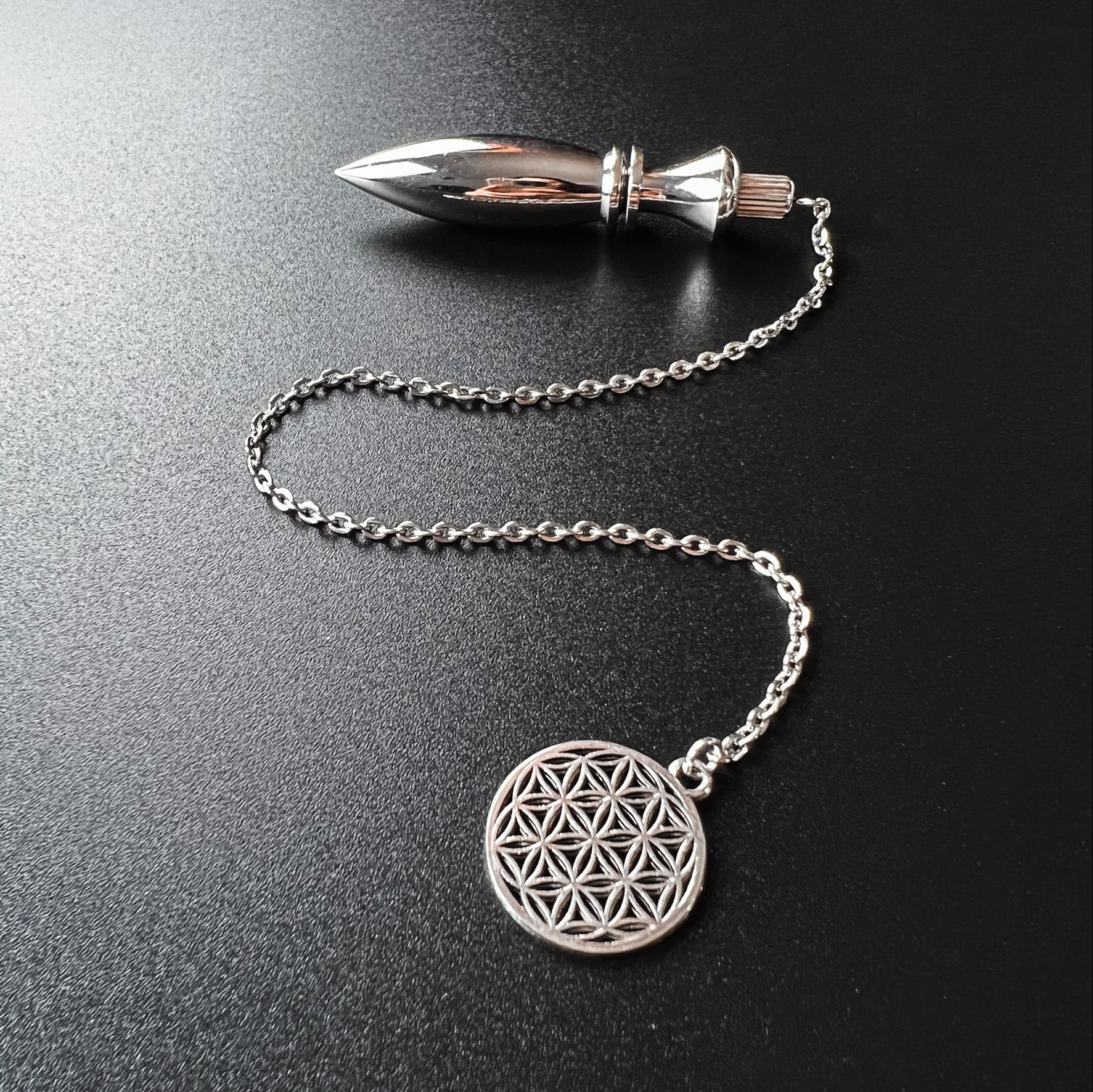 Metal Thot pendulum with a flower of life symbol Baguette Magick