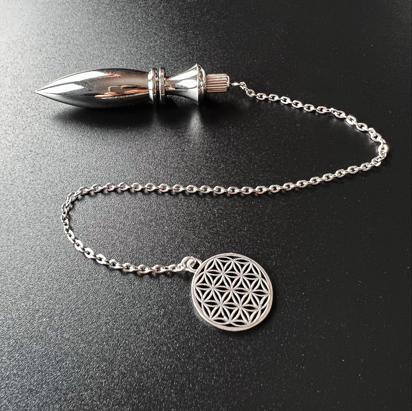 Metal Thot pendulum with a flower of life symbol Baguette Magick