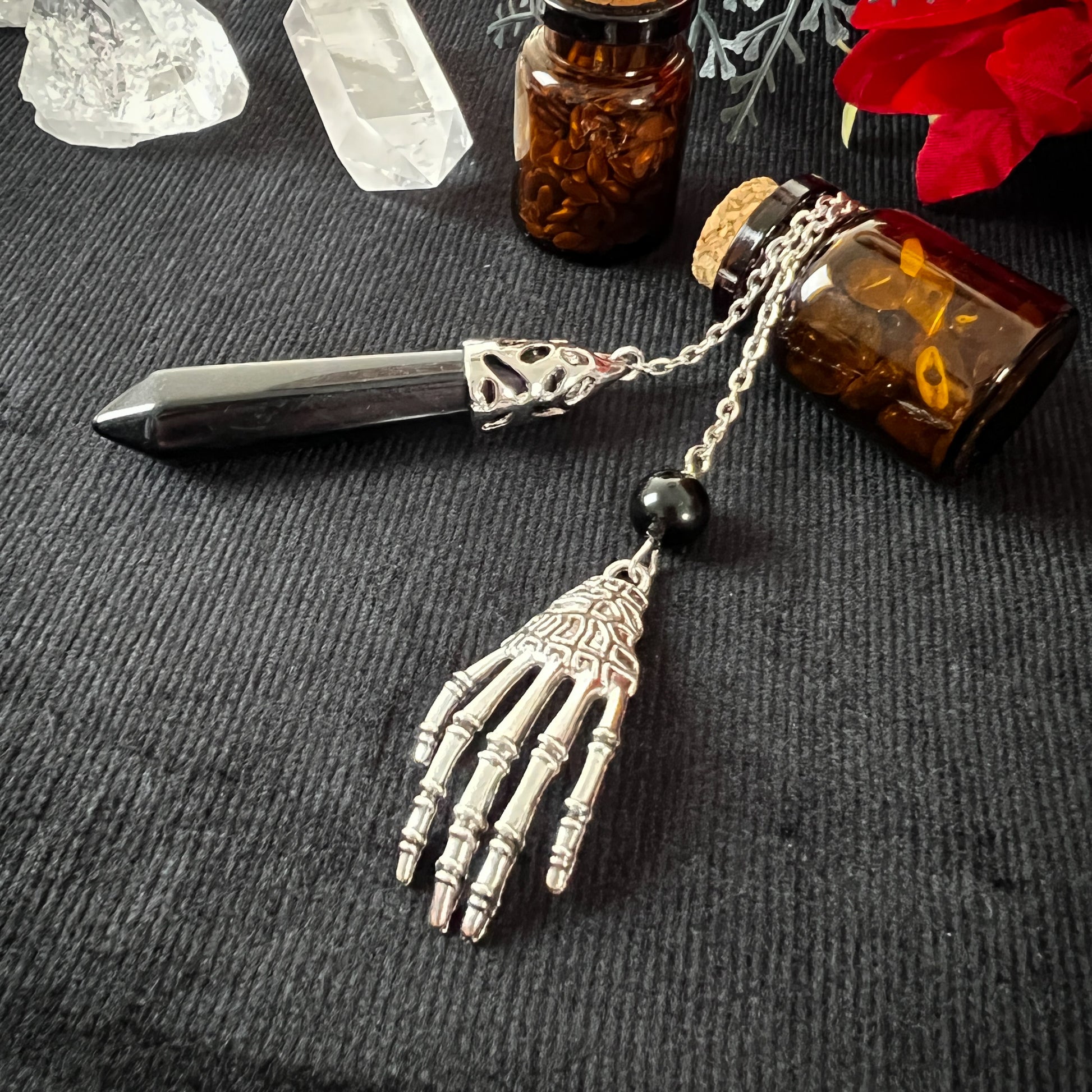 Onyx and skeleton hand dowsing pendulum
