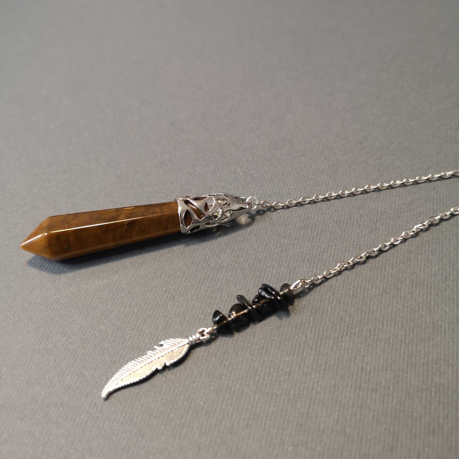 Tiger eye, obsidian and feather pendulum Baguette Magick