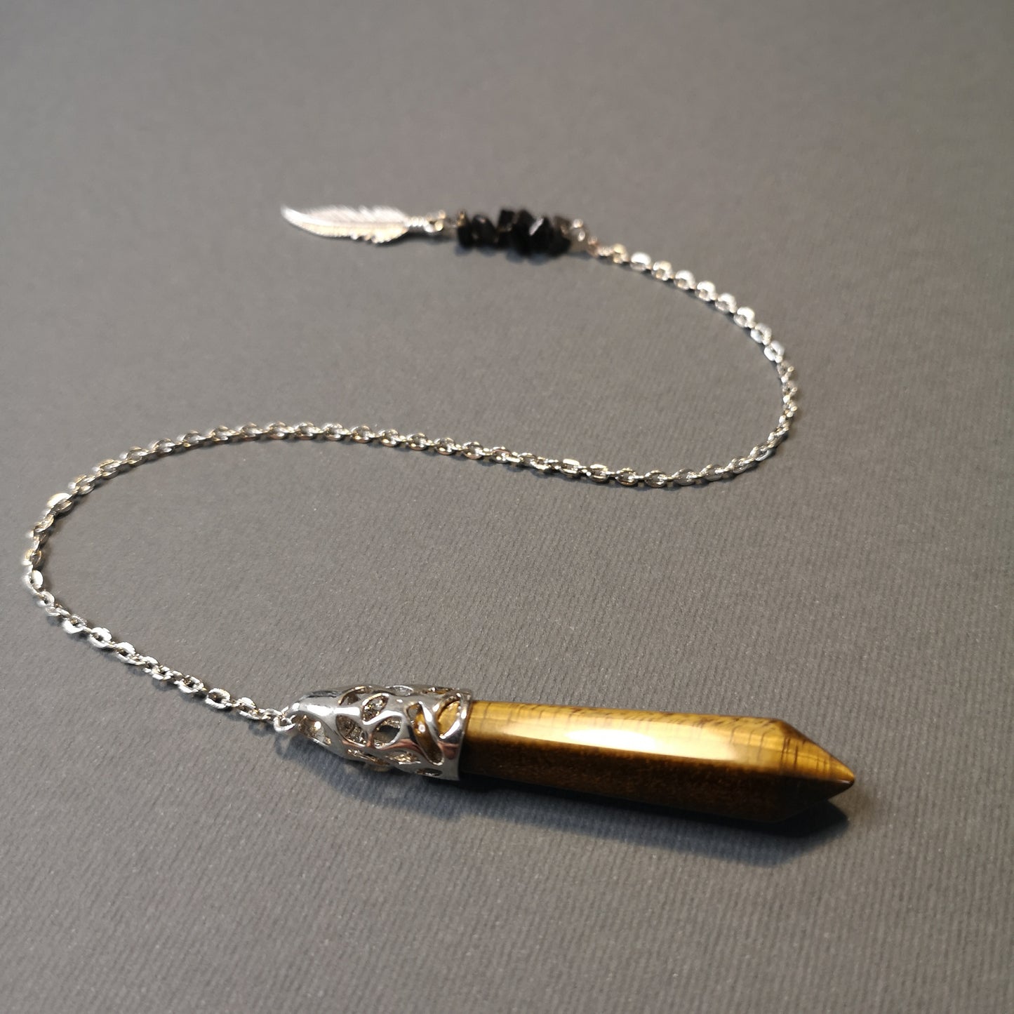 Tiger eye, obsidian and feather pendulum