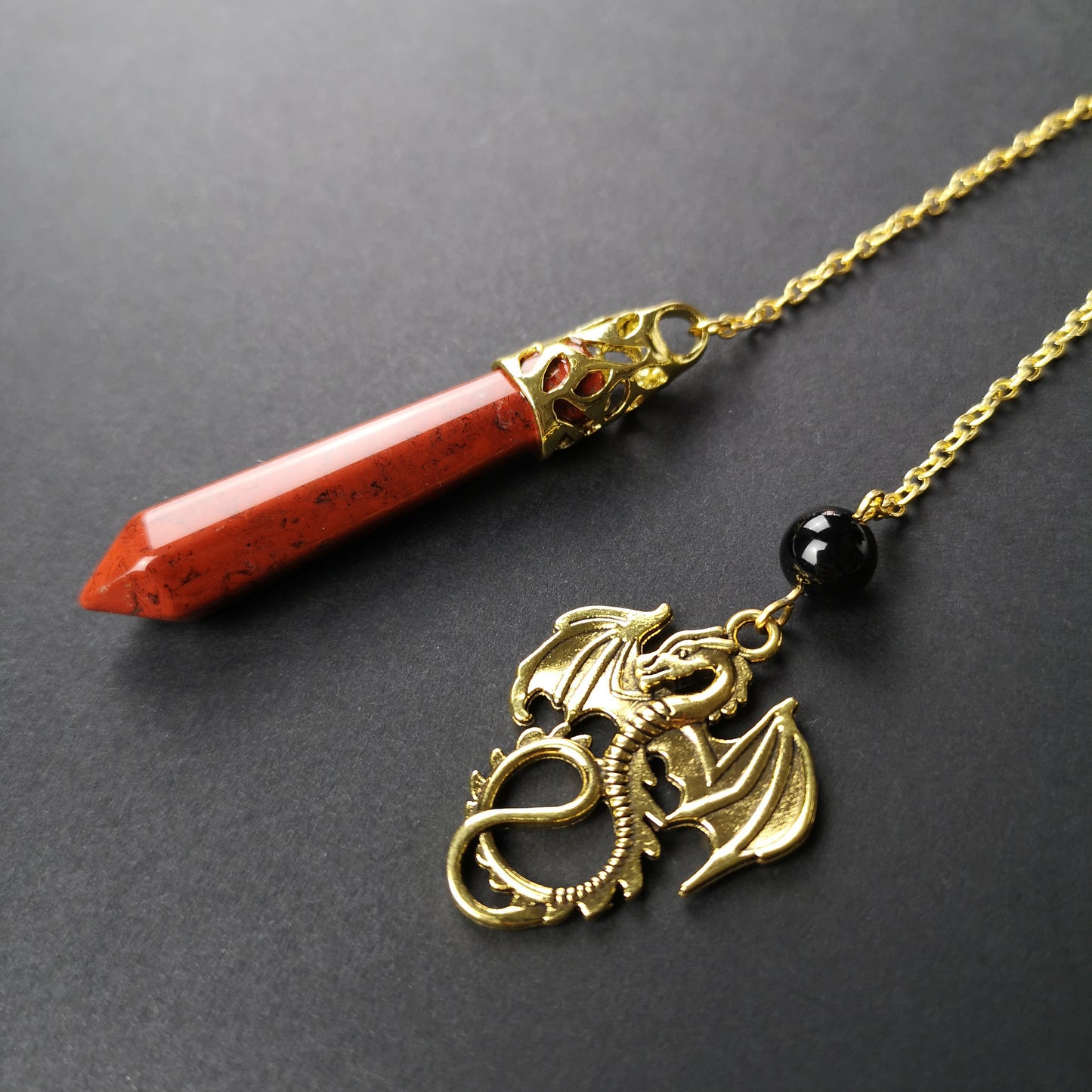 Golden Red jasper and obsidian dragon pendulum Baguette Magick