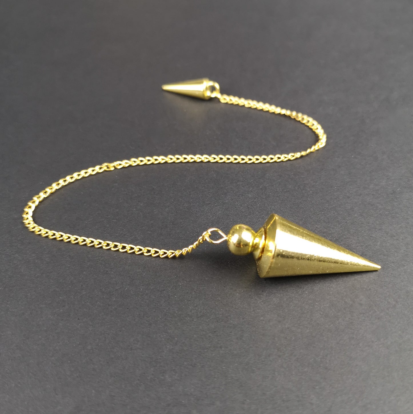 Cone golden metal dowsing pendulum with a chamber - The French Witch shop