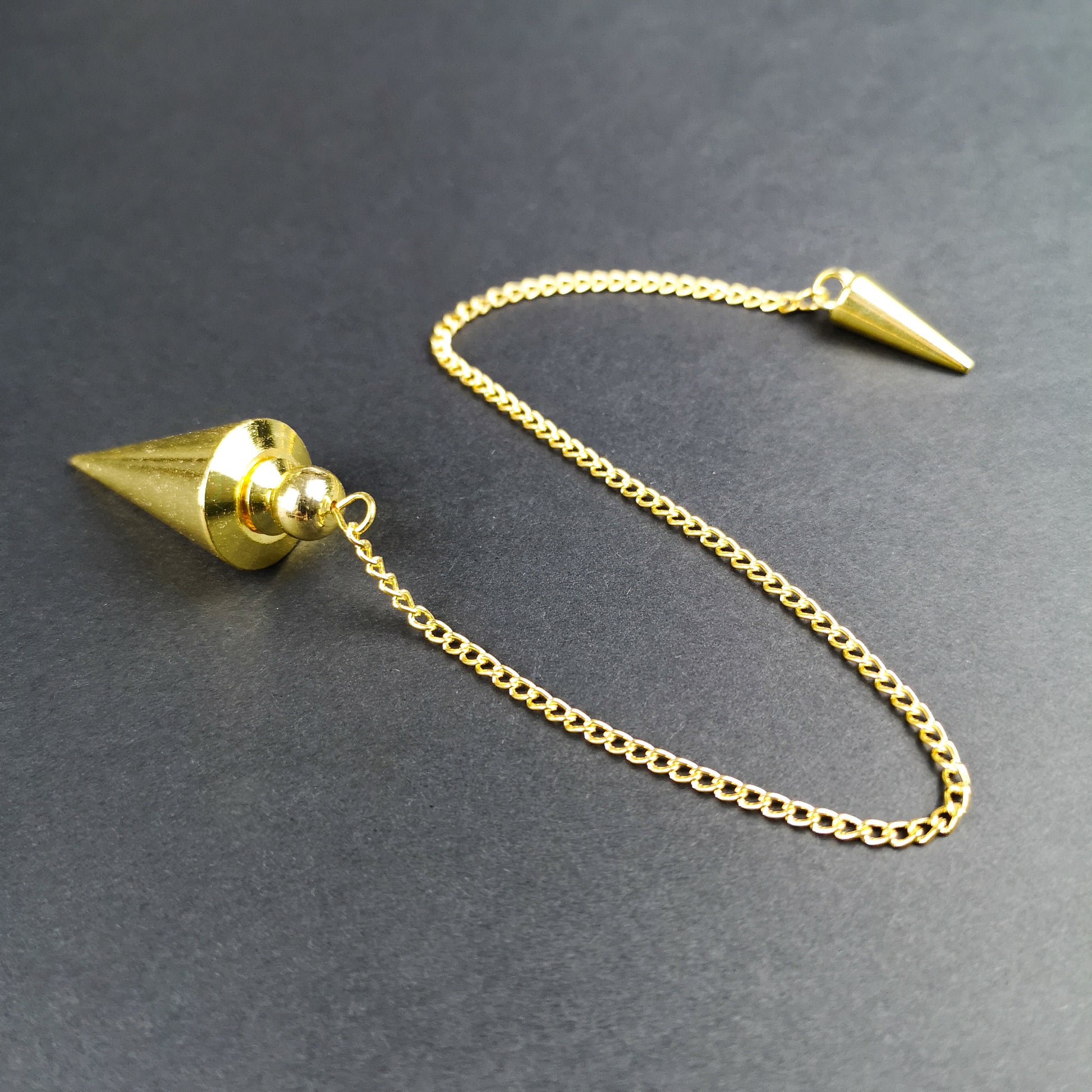 Cone golden metal dowsing pendulum with a chamber - The French Witch shop