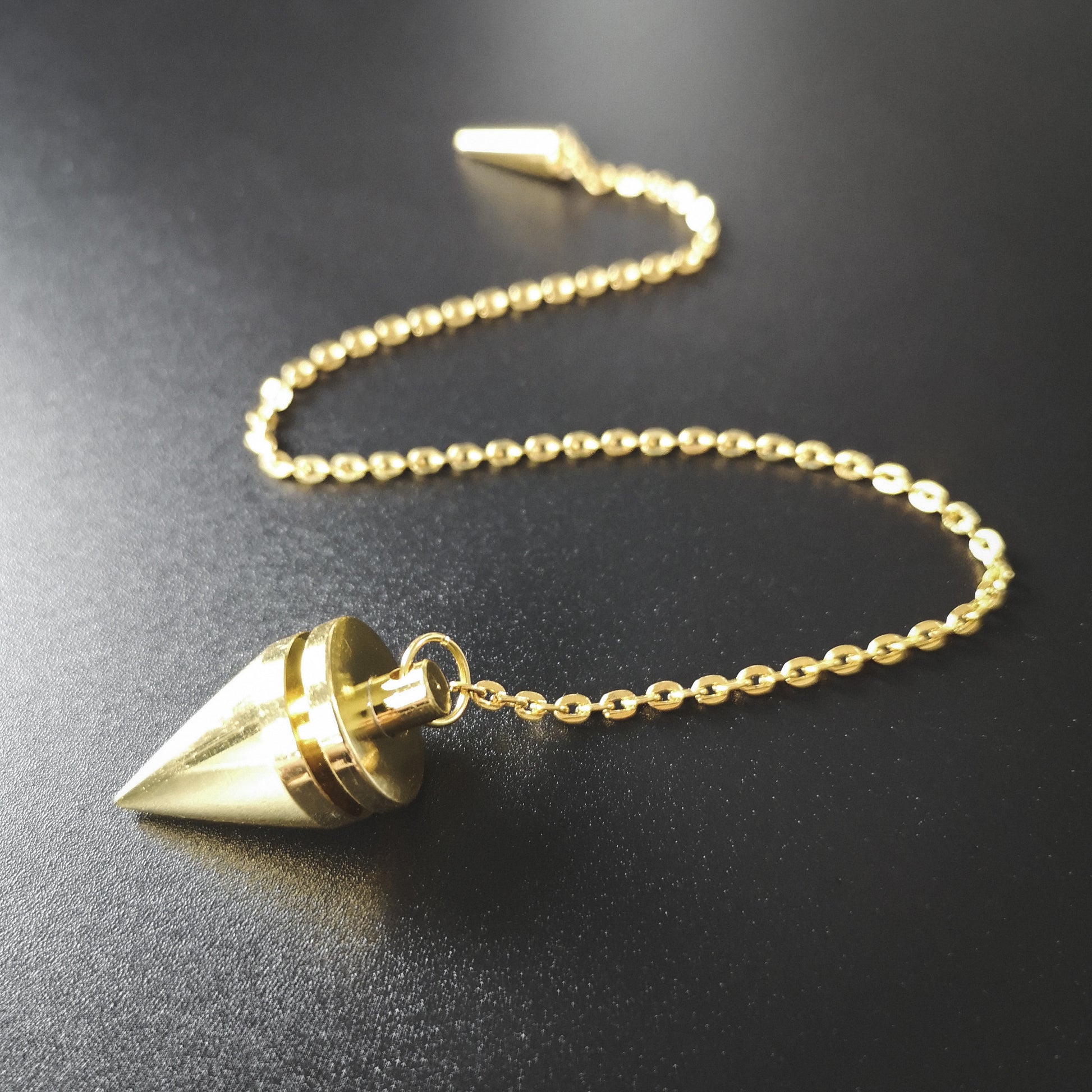 Golden cone and coil classic dowsing metal pendulum with a spike charm - The French Witch shop