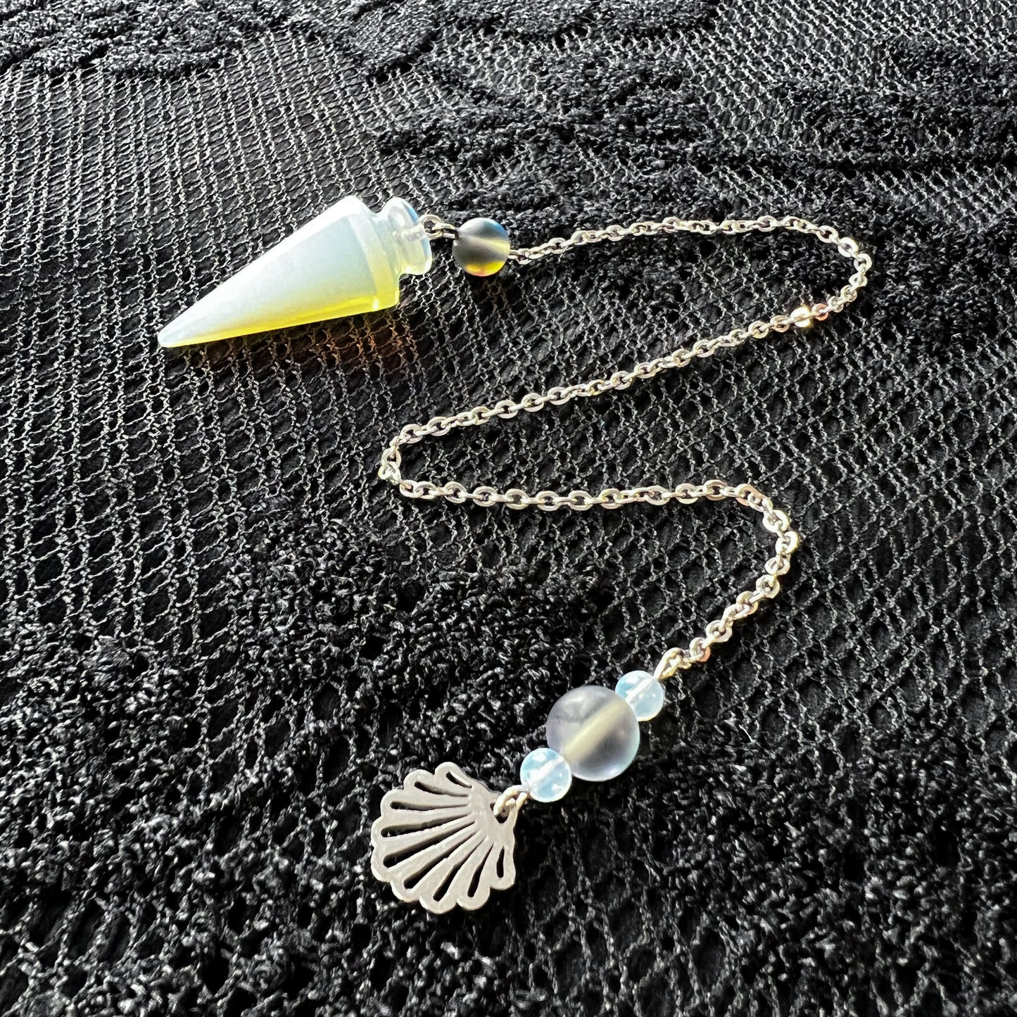 Sea witch pendulum made with opalite, stainless steel and mermaid glass The French Witch shop