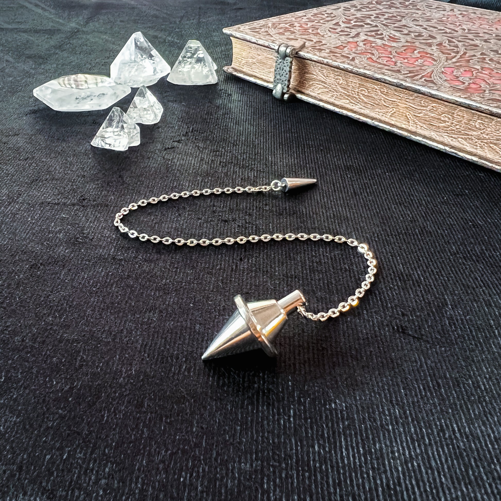 Silver-tone double cone pendulum with a spike charm Baguette Magick