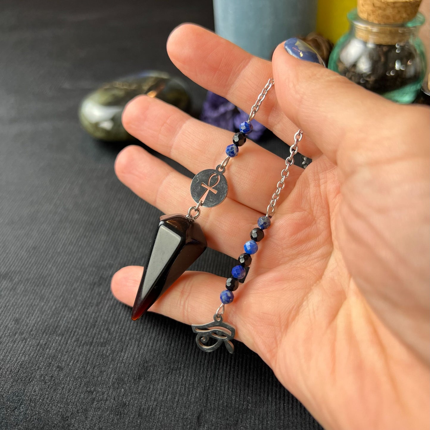 Stainless steel pendulum with obsidian, lapis lazuli, onyx, Eye of Horus and Ankh Baguette Magick