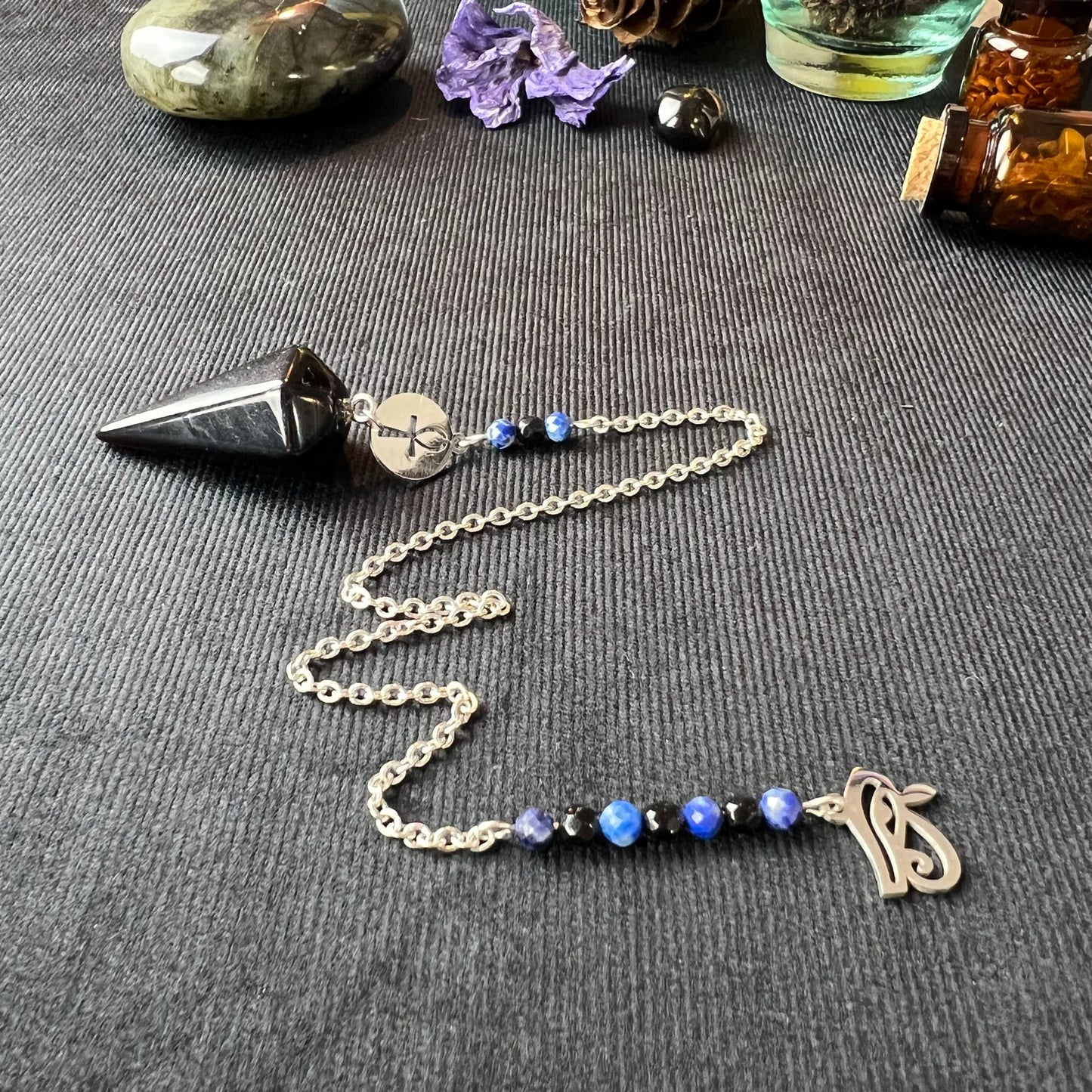 Stainless steel pendulum with obsidian, lapis lazuli, onyx, Eye of Horus and Ankh Baguette Magick