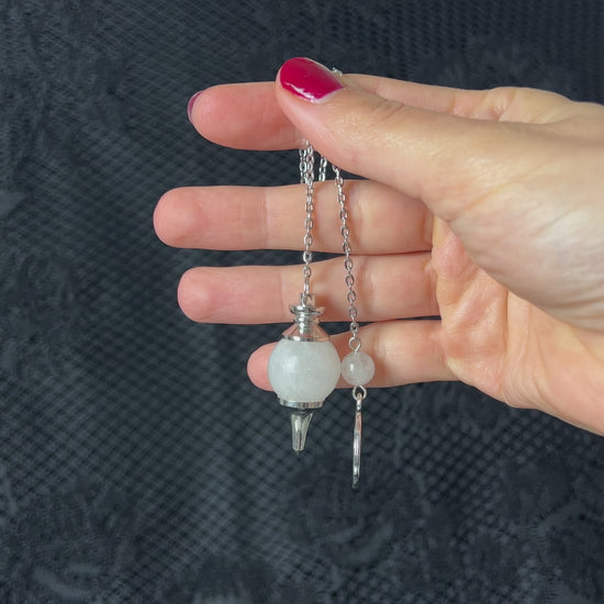 Clear quartz dowsing pendulum with a lotus charm Sephoroton gemstone pendulum divination tool