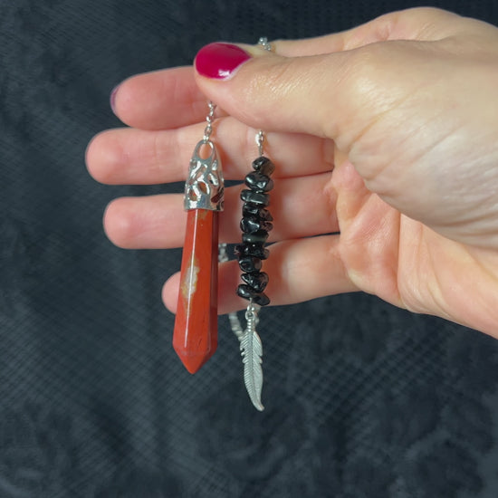 Red jasper dowsing pendulum, gemstone divination tool with obsidian beads and a feather charm