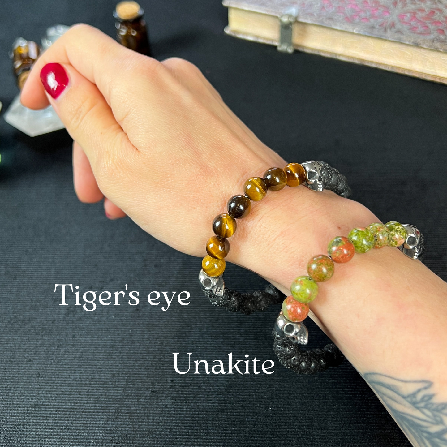 Lava rock and unakite or tiger's eye mala bracelet, with stainless steel skulls